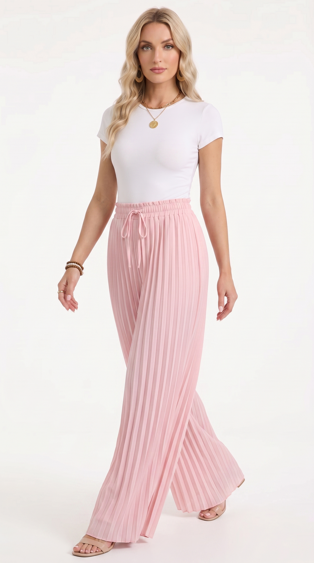 A woman modeling a white short-sleeve top and high-waisted, pleated light pink wide-leg pants with a drawstring waist, set against a plain white studio background, from Meleche Fashion USA or Meléche (short as (Mé))