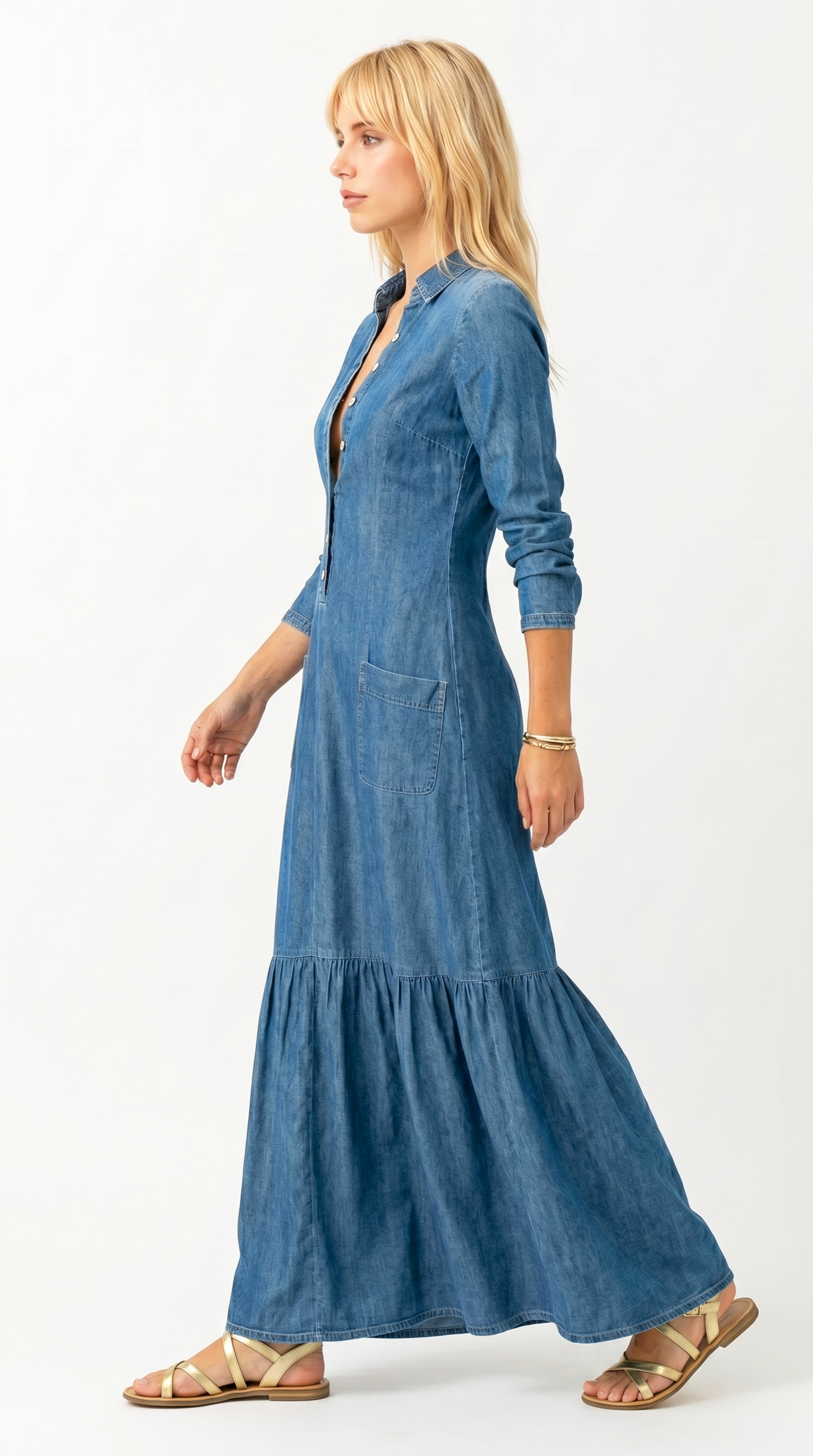 Woman wearing a long blue denim dress on a white background, Loos dress from Meleche Fashion USA or Meléche (short as (Mé))