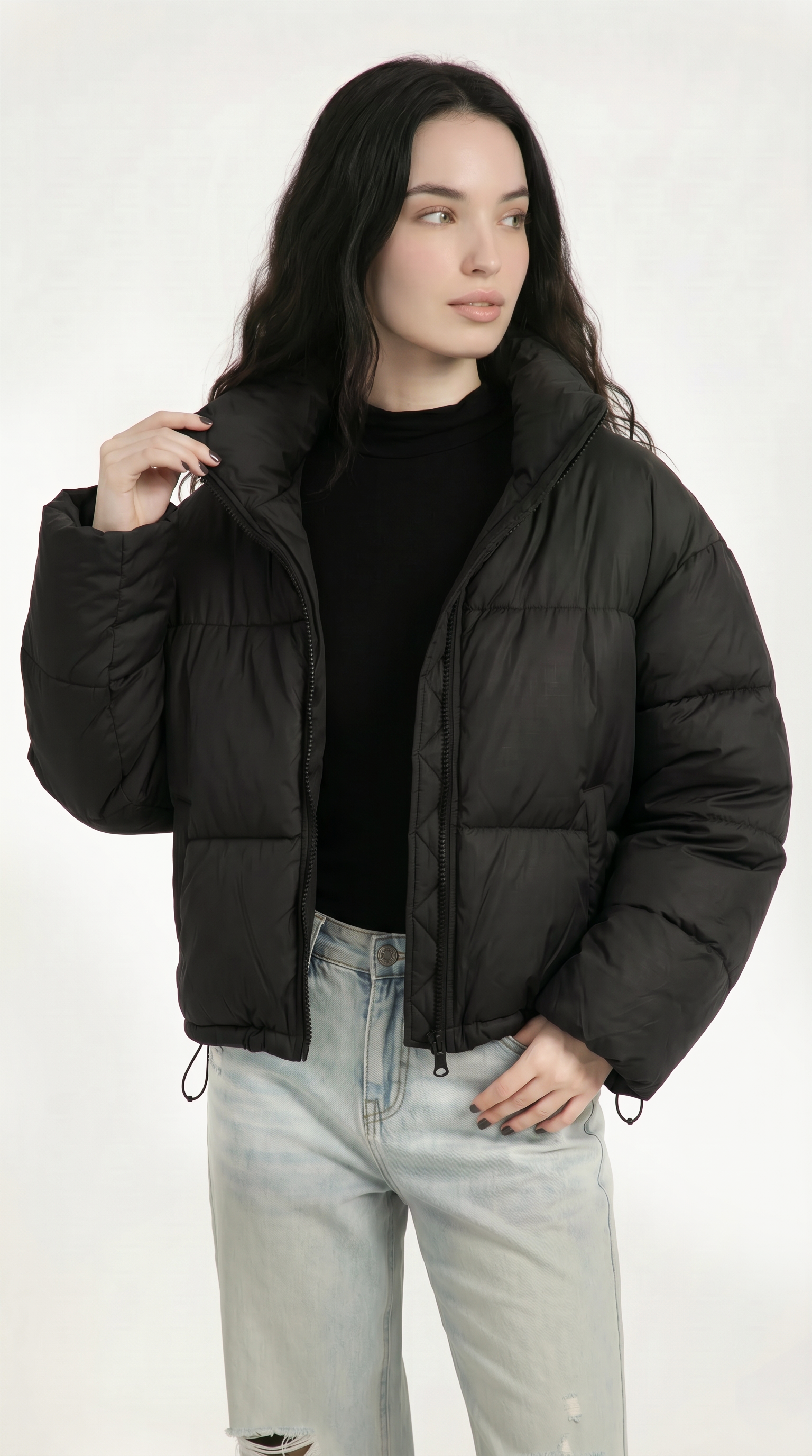 Woman wearing a black puffer jacket on a white background from Meleche or Meléche USA (short as (Mé))