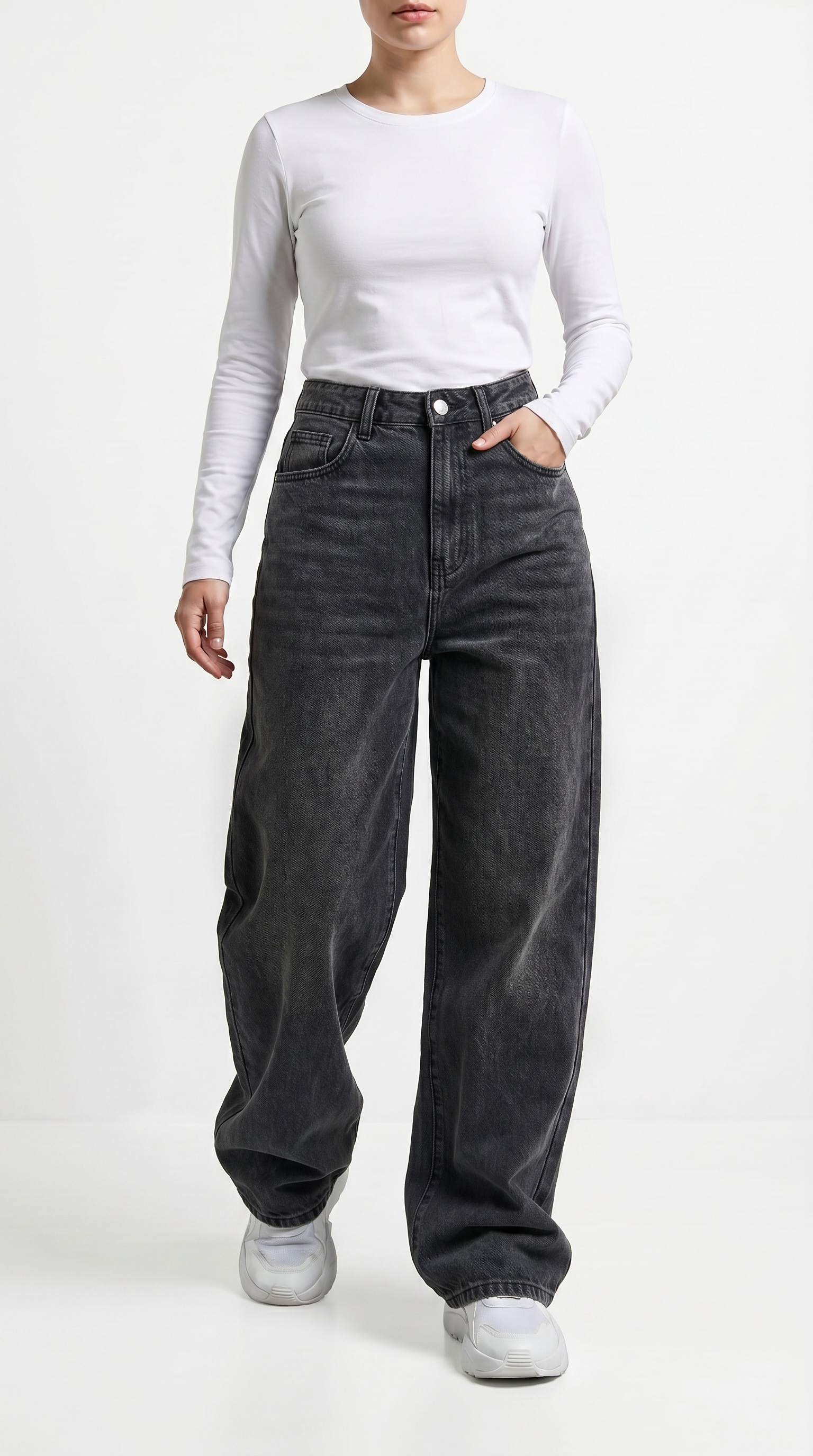 Person wearing a white long-sleeve top and black high-waisted jeans on a white background, Relaxed Fit Egyptian cotton jeans from Meleche Fashion USA or Meléche (short as (Mé))