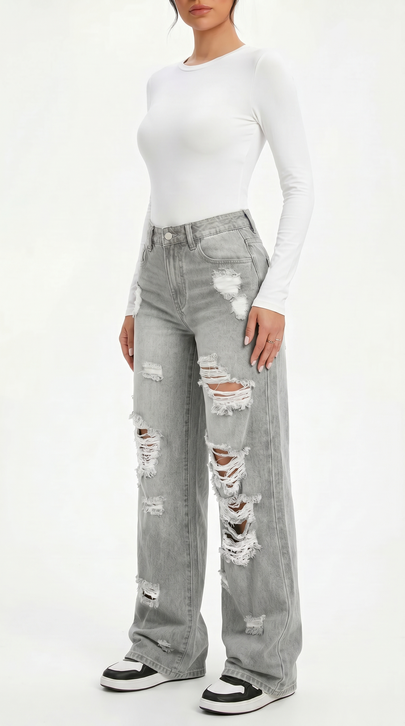 Person wearing a white long-sleeve top and gray ripped jeans on a white background, Wide-leg jeans from Meleche Fashion USA or Meléche (short as (Mé))