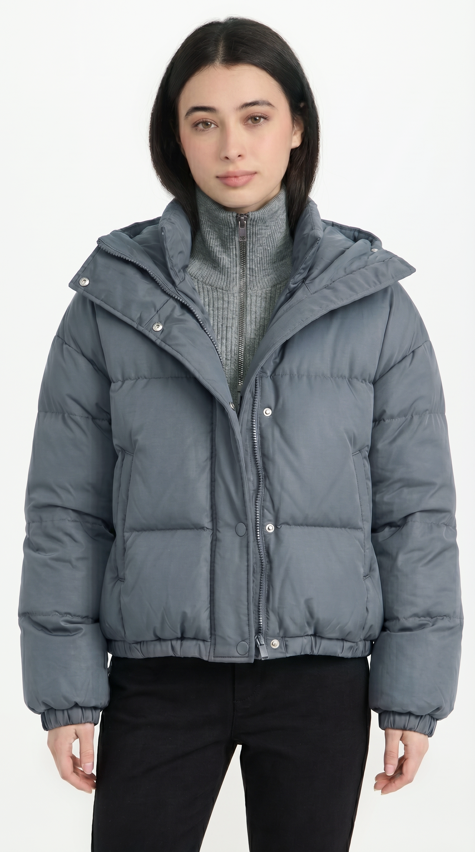 Person wearing a gray puffer jacket on a white background from Meleche or Meléche USA (short as (Mé))
