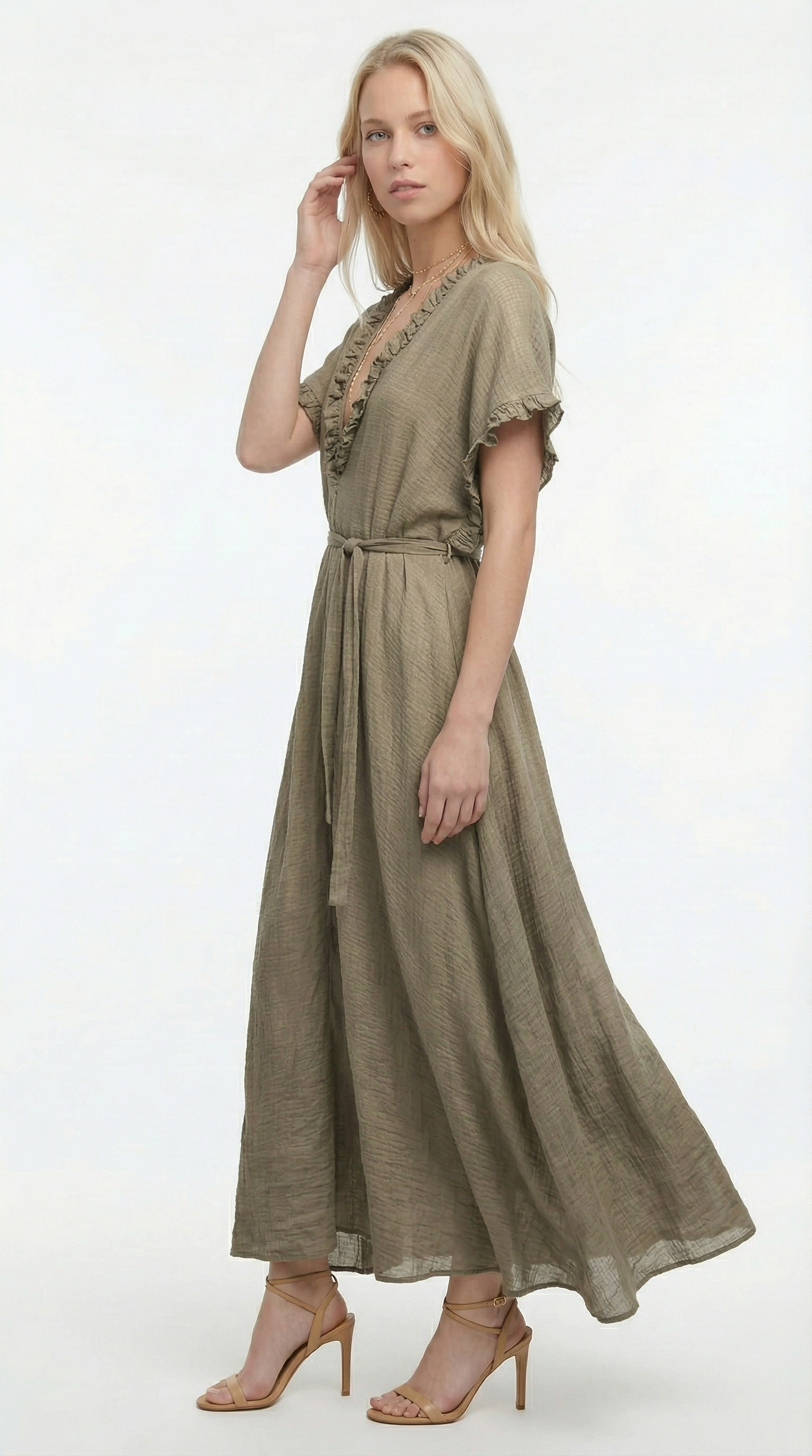 Woman wearing a blue one-shoulder dress on a white background