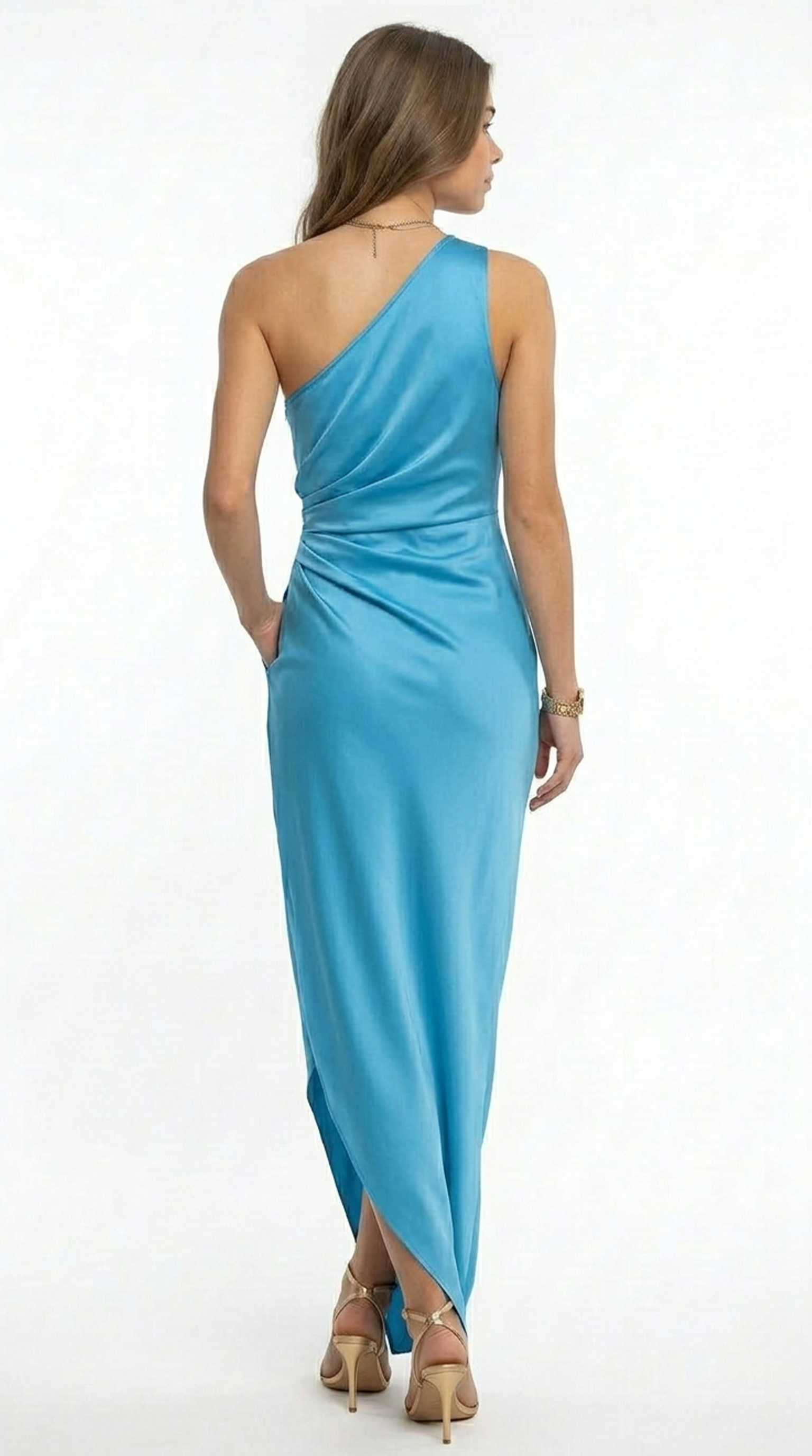 Woman wearing a black oversized sweater and white pants on a white background