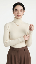 Woman wearing a cream turtleneck sweater and brown pants on a white background from Meleche USA or Meléche (short as (Mé))