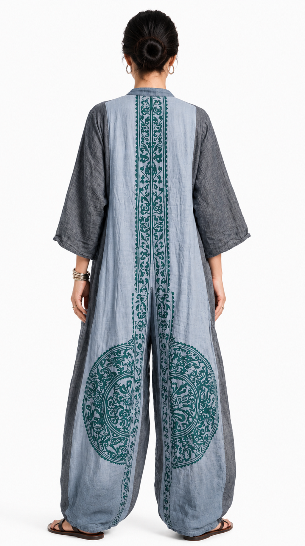 Woman wearing a long, light gray dress with green patterns on a white background, from Meleche Fashion USA or Meléche (short as (Mé))