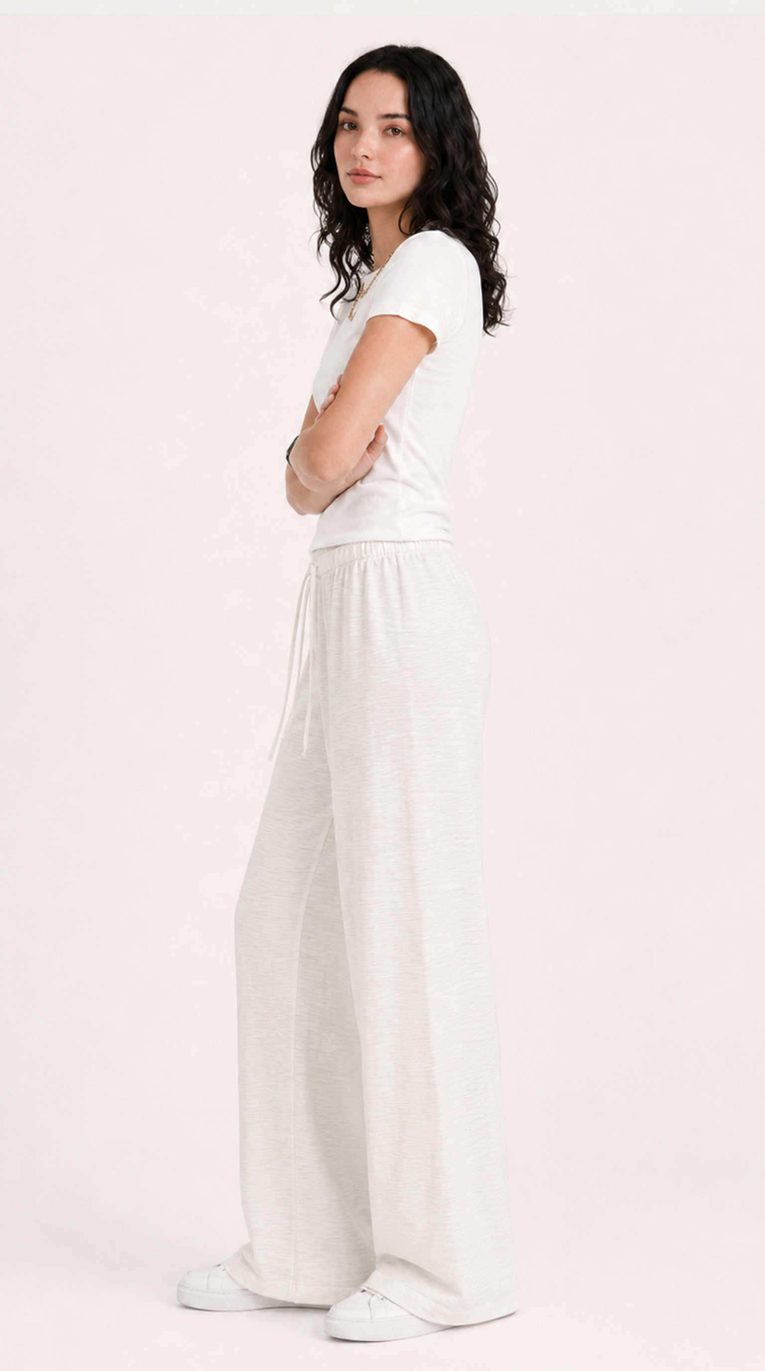 Woman wearing a white outfit on a plain background, from Meleche Fashion USA or Meléche (short as (Mé))