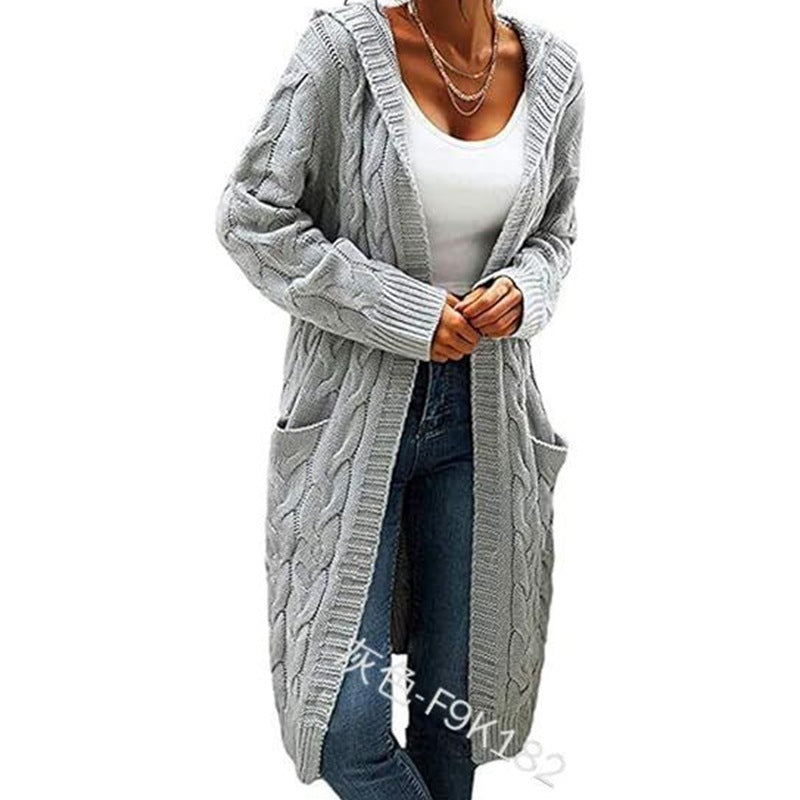 Person wearing a long gray cable knit cardigan from Meleche or Meléche (short as (Mé))