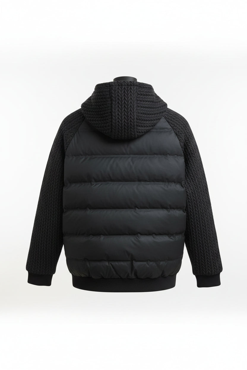 Black puffer jacket with knitted sleeves on a mannequin in a store setting.