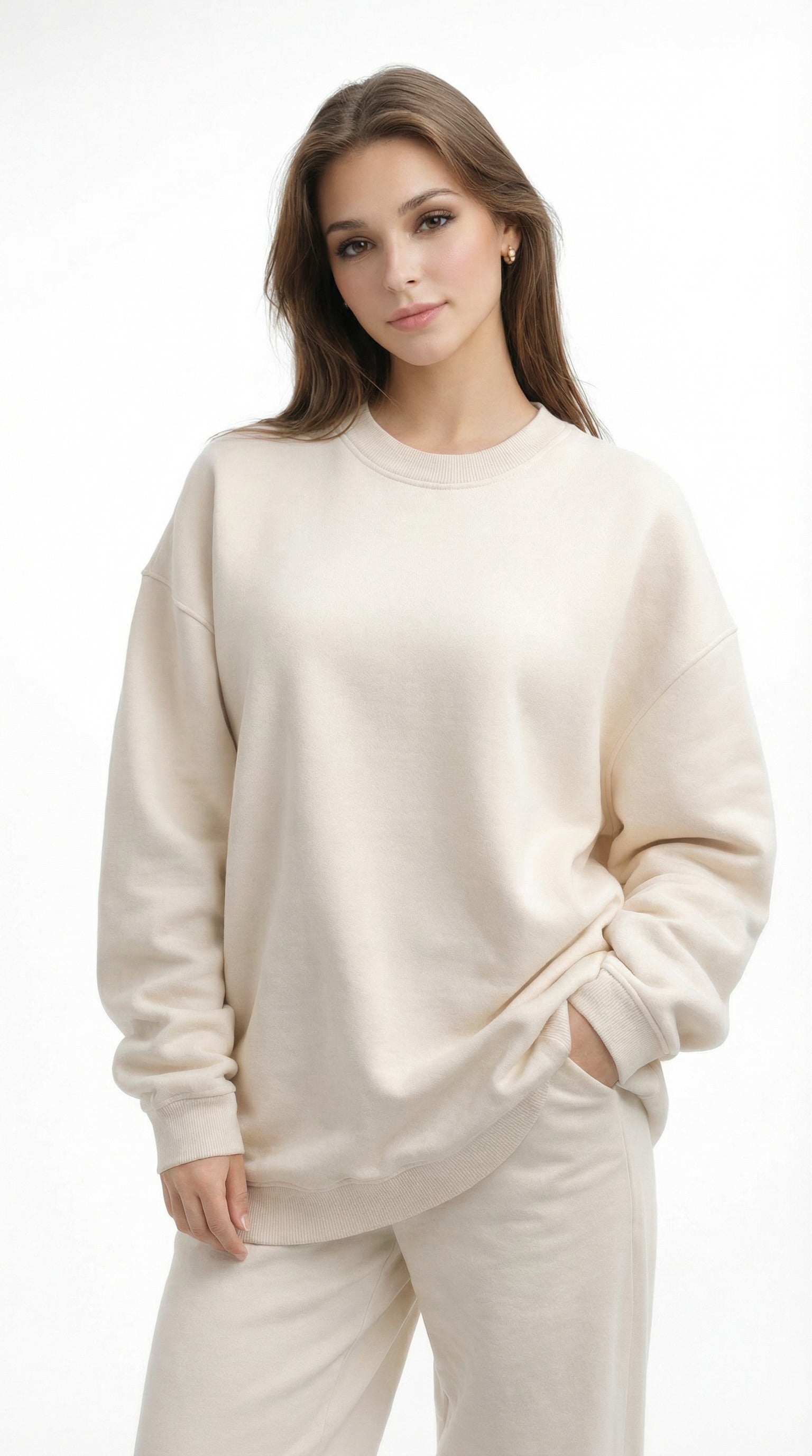 Woman wearing a beige sweater and pants from Meleche or Meléche (short as (Mé))