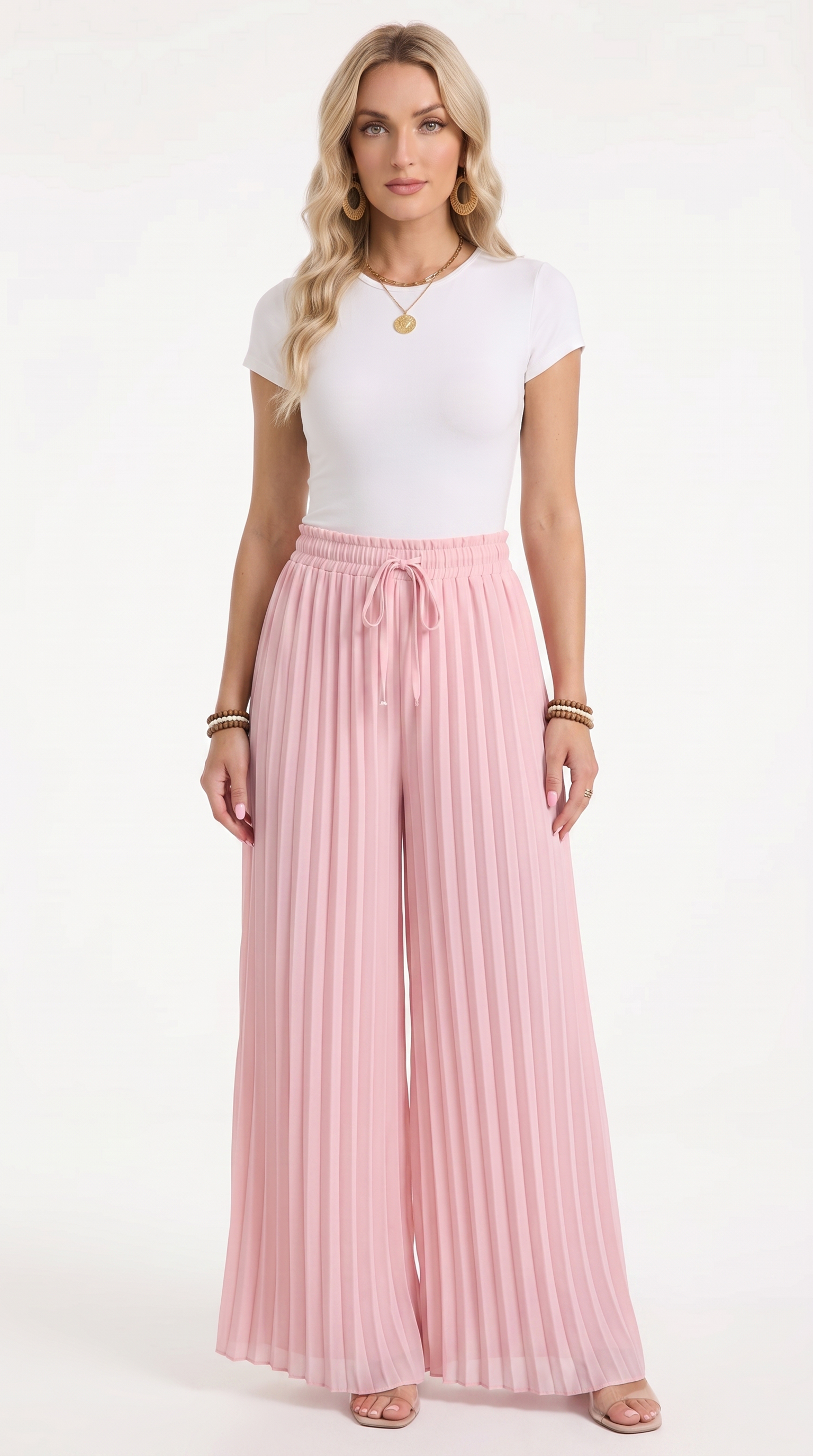 A woman modeling a white short-sleeve top and light pink pleated wide-leg pants with a drawstring waist, standing against a plain white studio background, from Meleche Fashion USA or Meléche (short as (Mé))