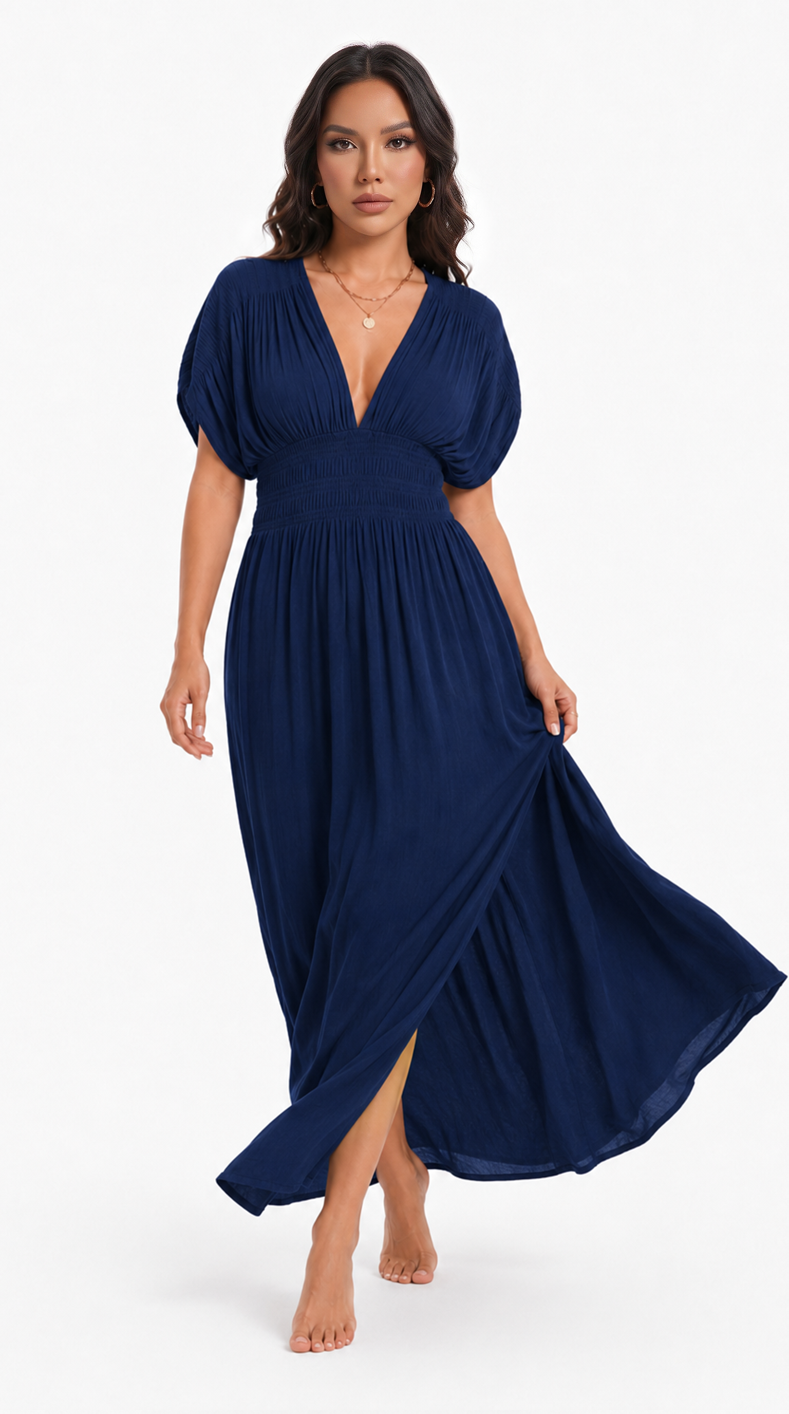 A woman modeling a navy blue maxi dress with a deep V-neckline, puffed short sleeves, and a flowing skirt with a side slit, set against a plain white studio background, from Meleche Fashion USA or Meléche (short as (Mé))