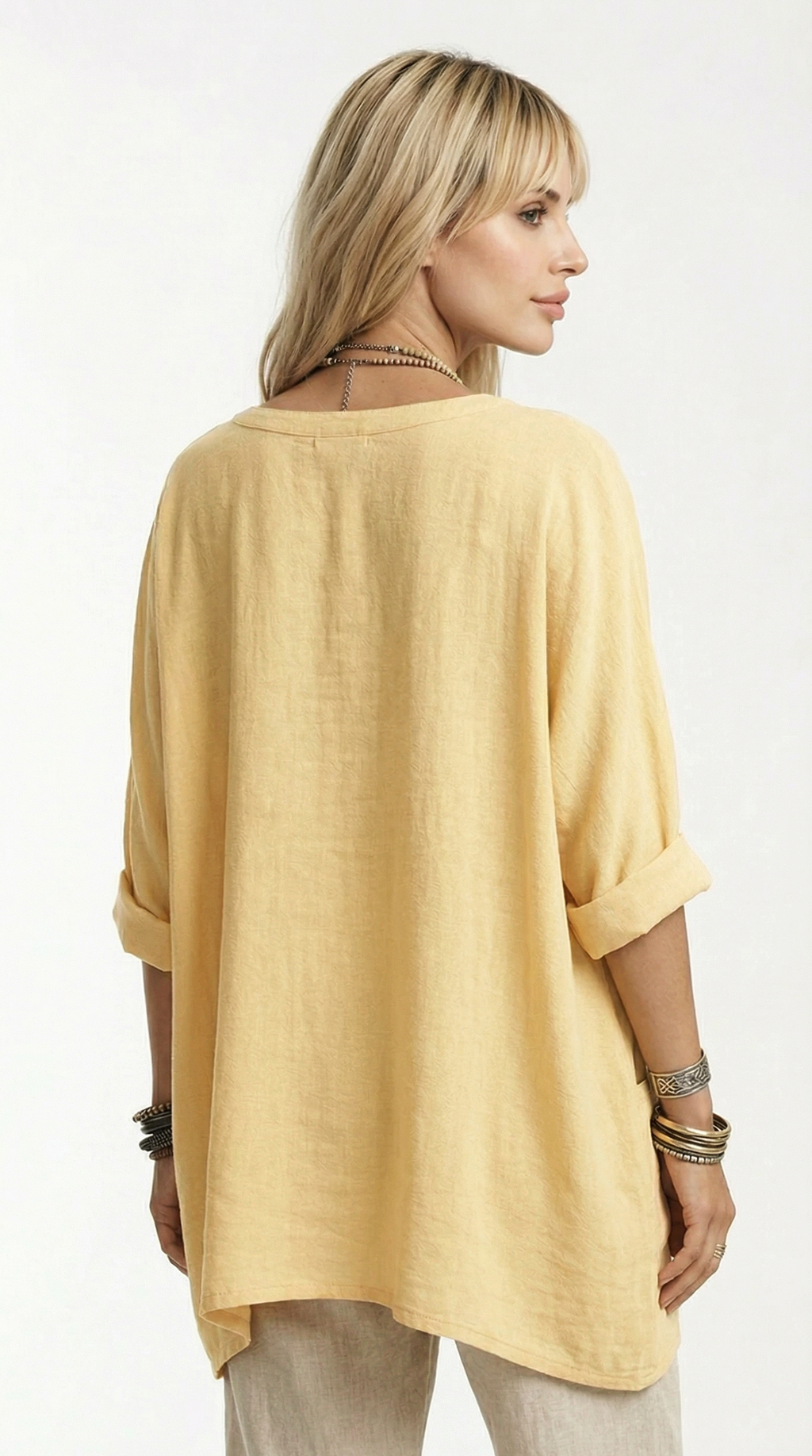 Woman wearing a yellow oversized shirt on a white background from Meleche or Meléche (short as (Mé))