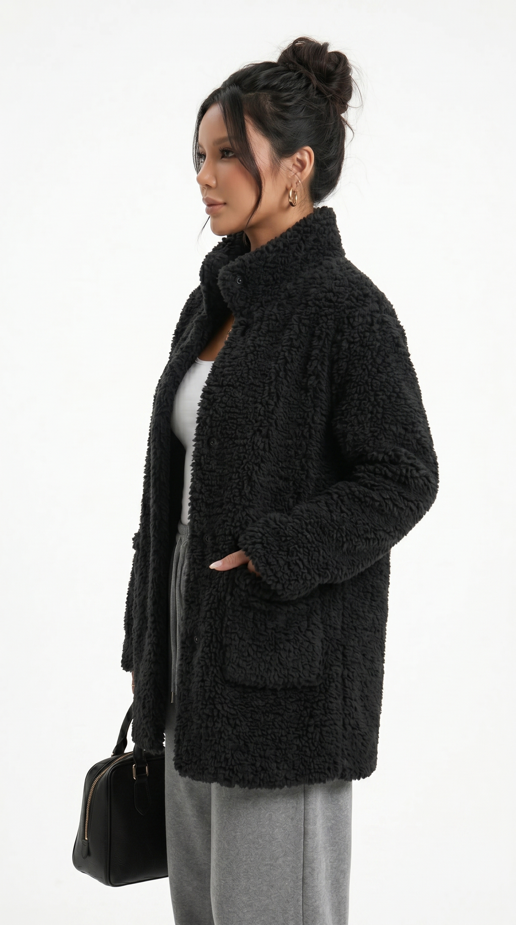 Woman wearing a black teddy coat on a white background from Meleche Fashion USA or Meléche (short as (Mé))