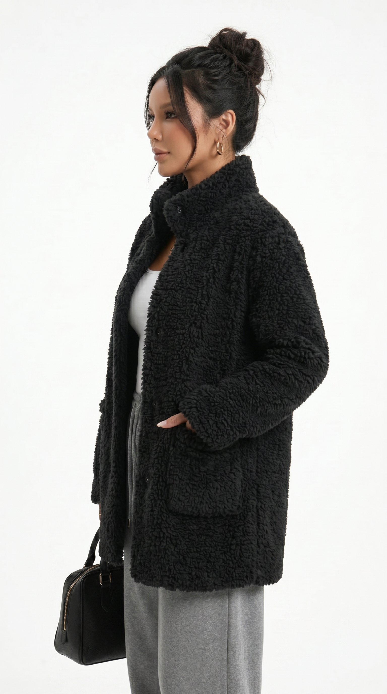 Woman wearing a black teddy coat on a white background from Meleche Fashion USA or Meléche (short as (Mé))