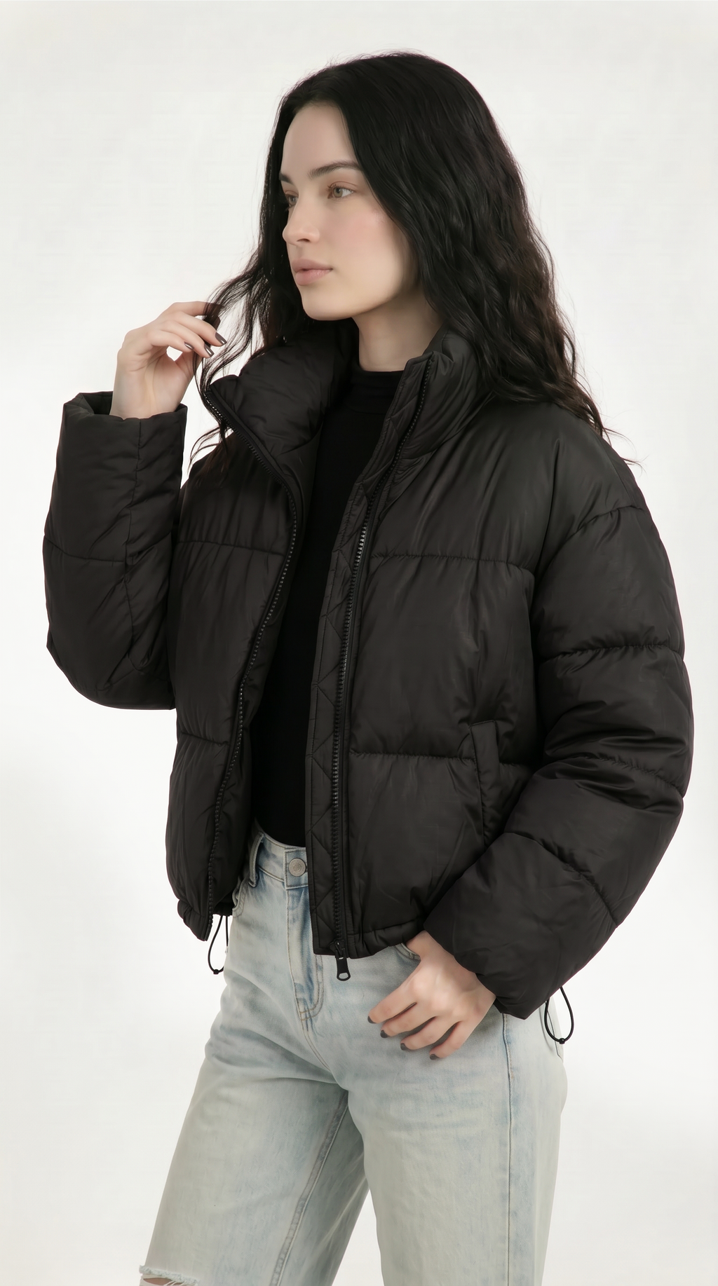 Woman wearing a black puffer jacket on a white background from Meleche USA or Meléche (short as (Mé))