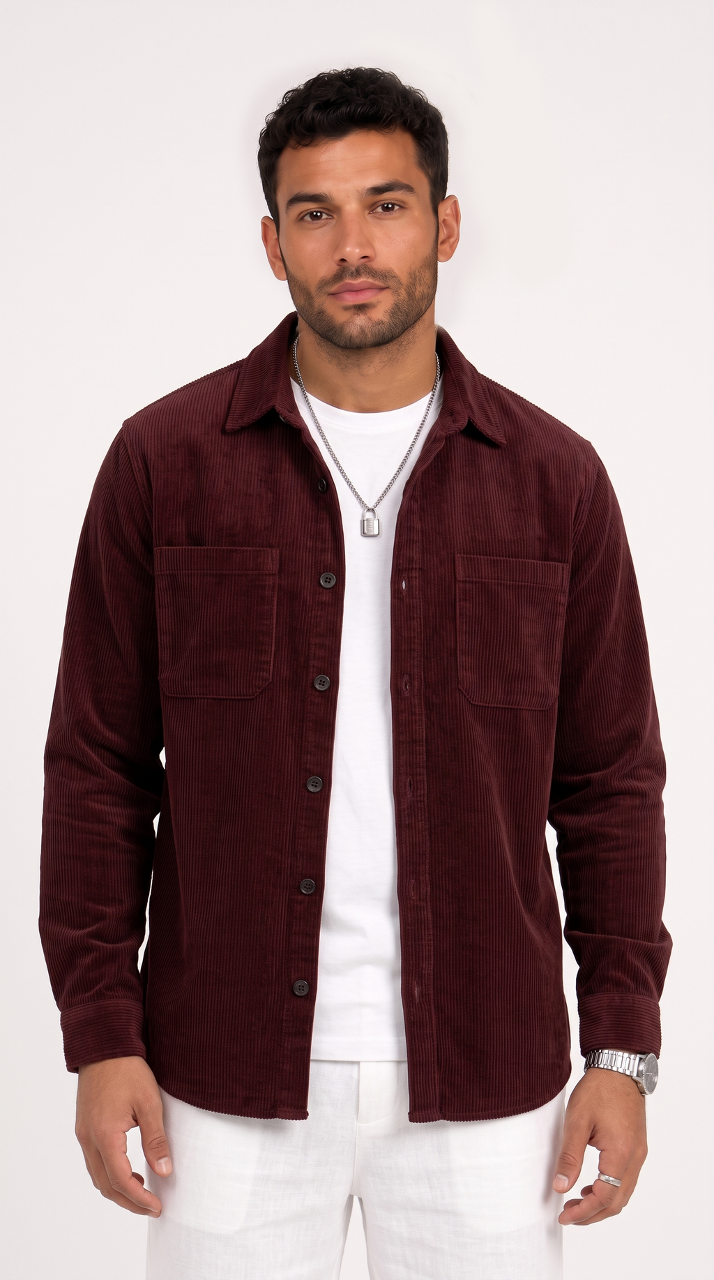 A man wearing a dark burgundy corduroy button-up shirt jacket over a white t-shirt and white pants, standing against a plain white studio background, from Meleche Fashion USA or Meléche (short as (Mé))