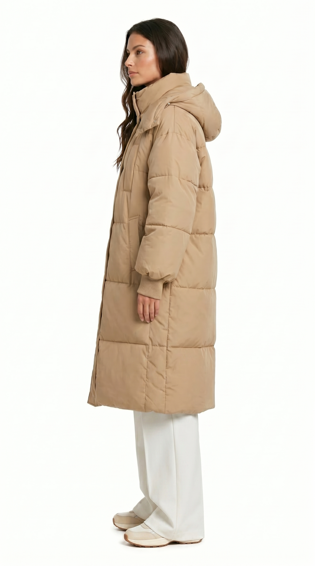 Woman wearing a beige puffer coat on a white background from Meleche Fashion USA or Meléche (short as (Mé))