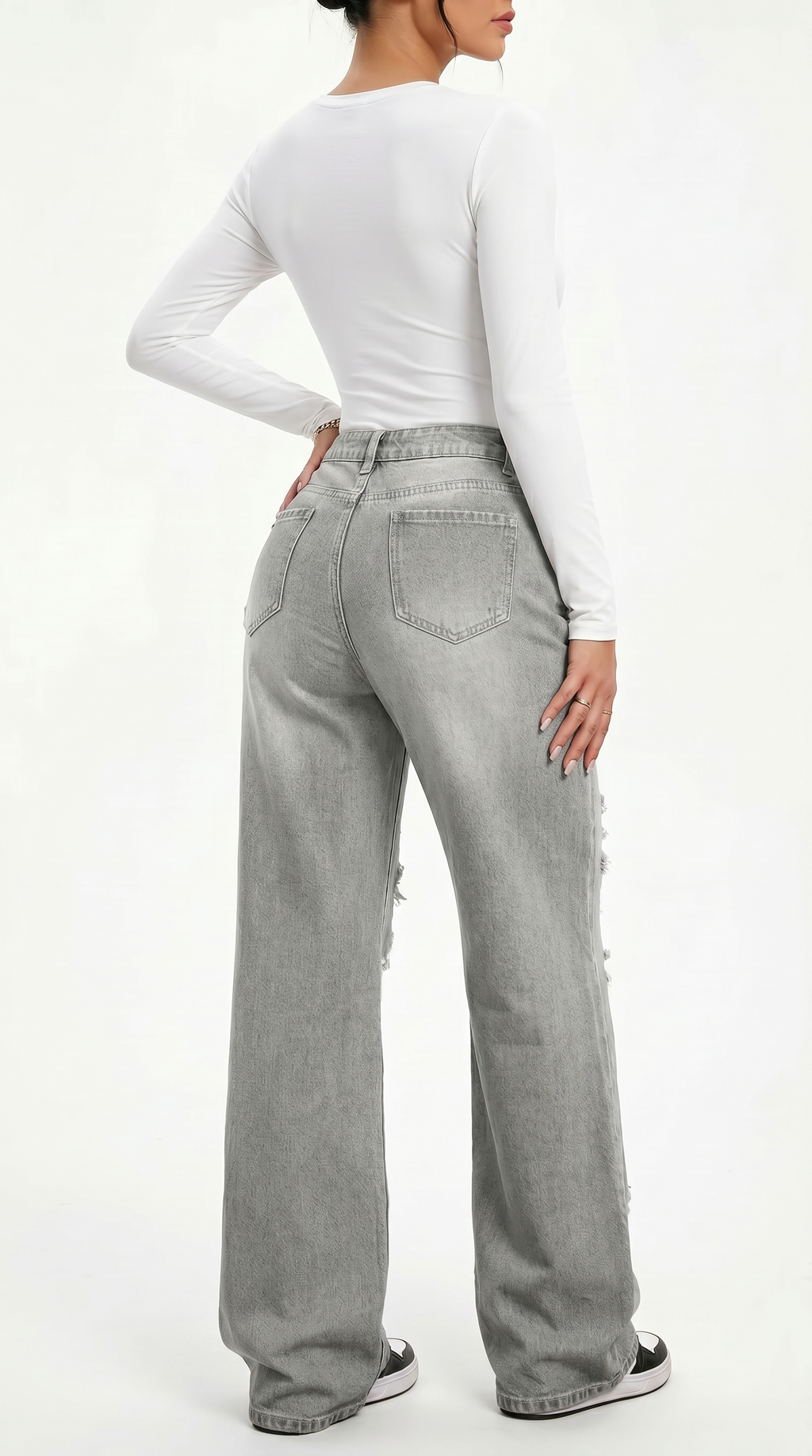 Person wearing gray high-waisted jeans and a white long-sleeve top on a white background, Wide-leg jeans from Meleche Fashion USA or Meléche (short as (Mé))