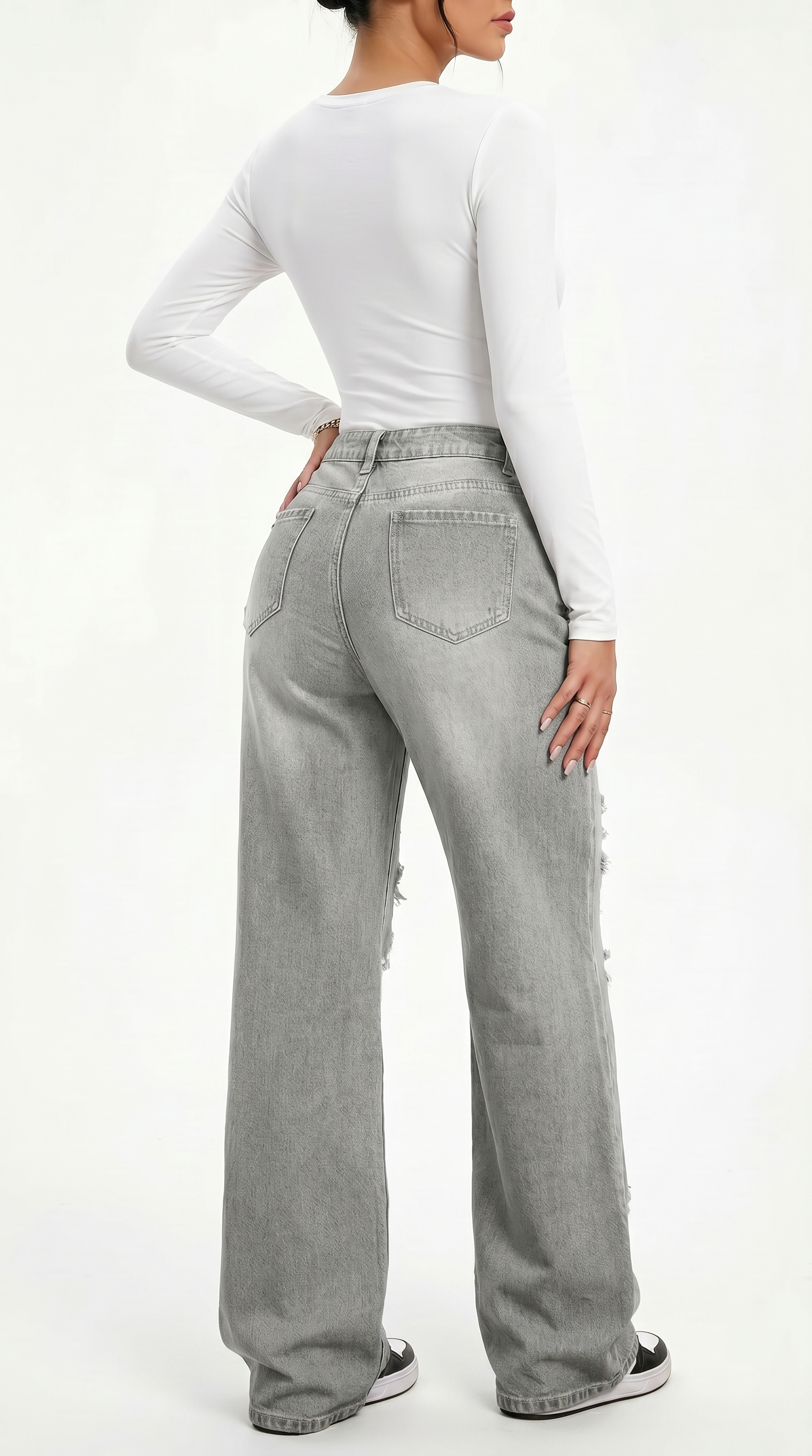 Person wearing gray high-waisted jeans and a white long-sleeve top on a white background, Wide-leg jeans from Meleche Fashion USA or Meléche (short as (Mé))