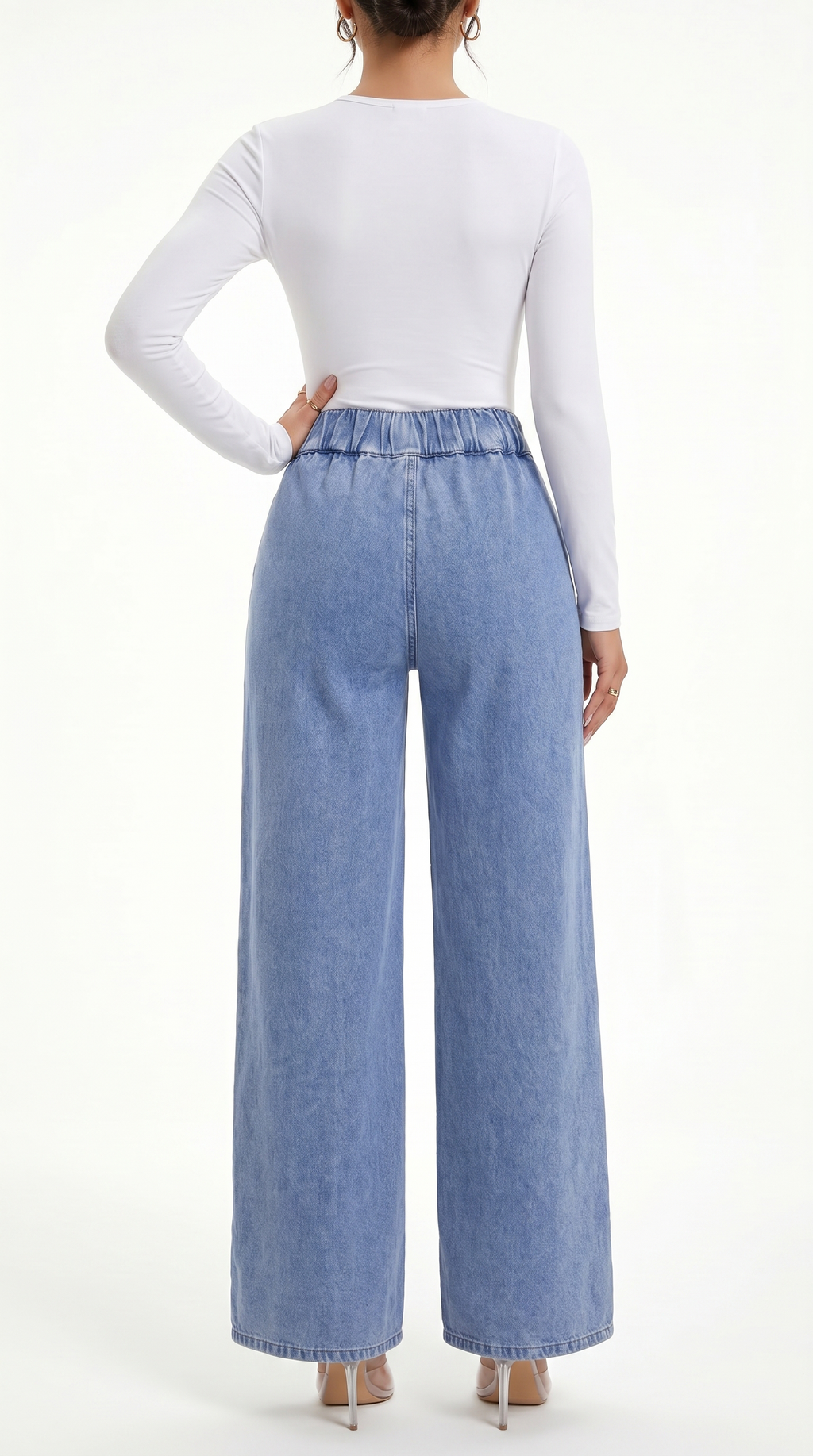 Person wearing a white long-sleeve top and blue wide-leg jeans on a white background, Straight Leg jeans from Meleche Fashion USA or Meléche (short as (Mé))