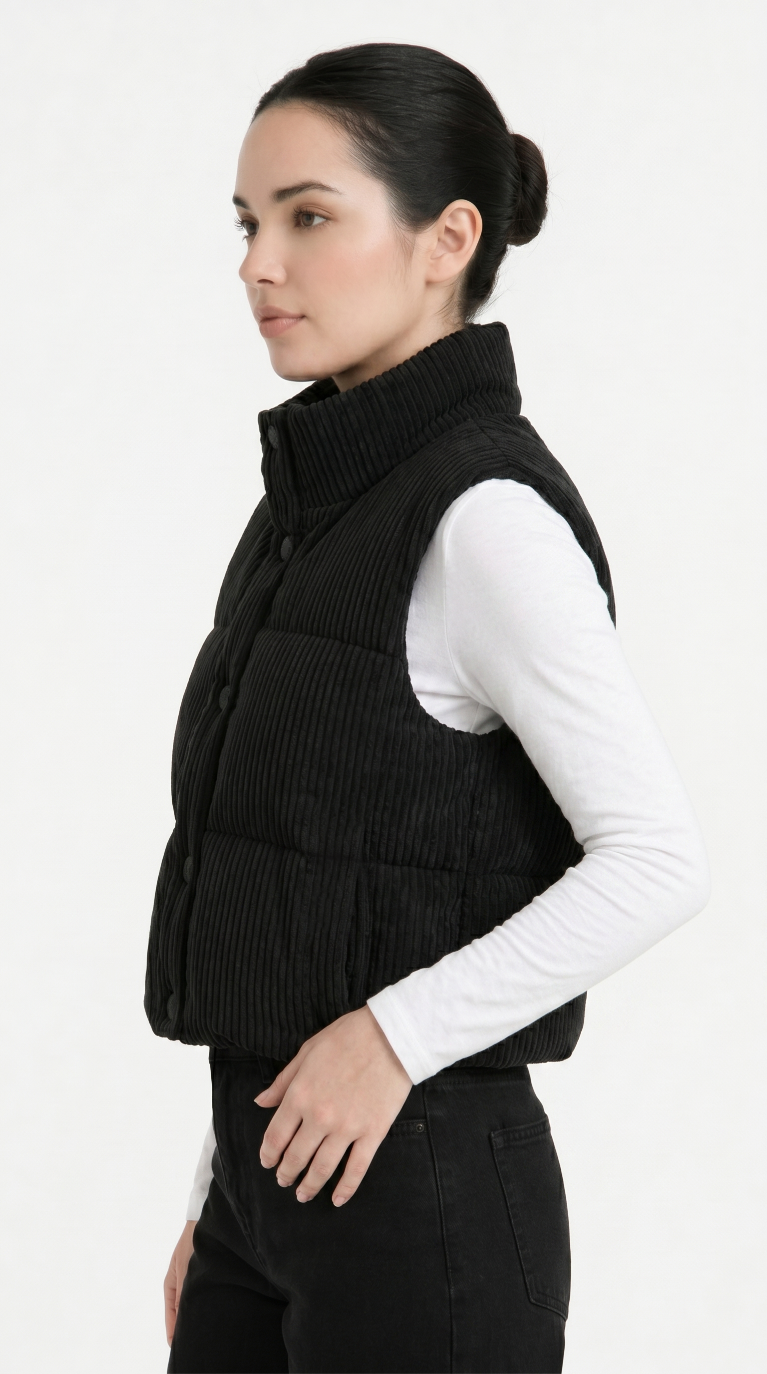 Woman wearing a black vest over a white shirt on a white background from Meleche Fashion USA or Meléche (short as (Mé))