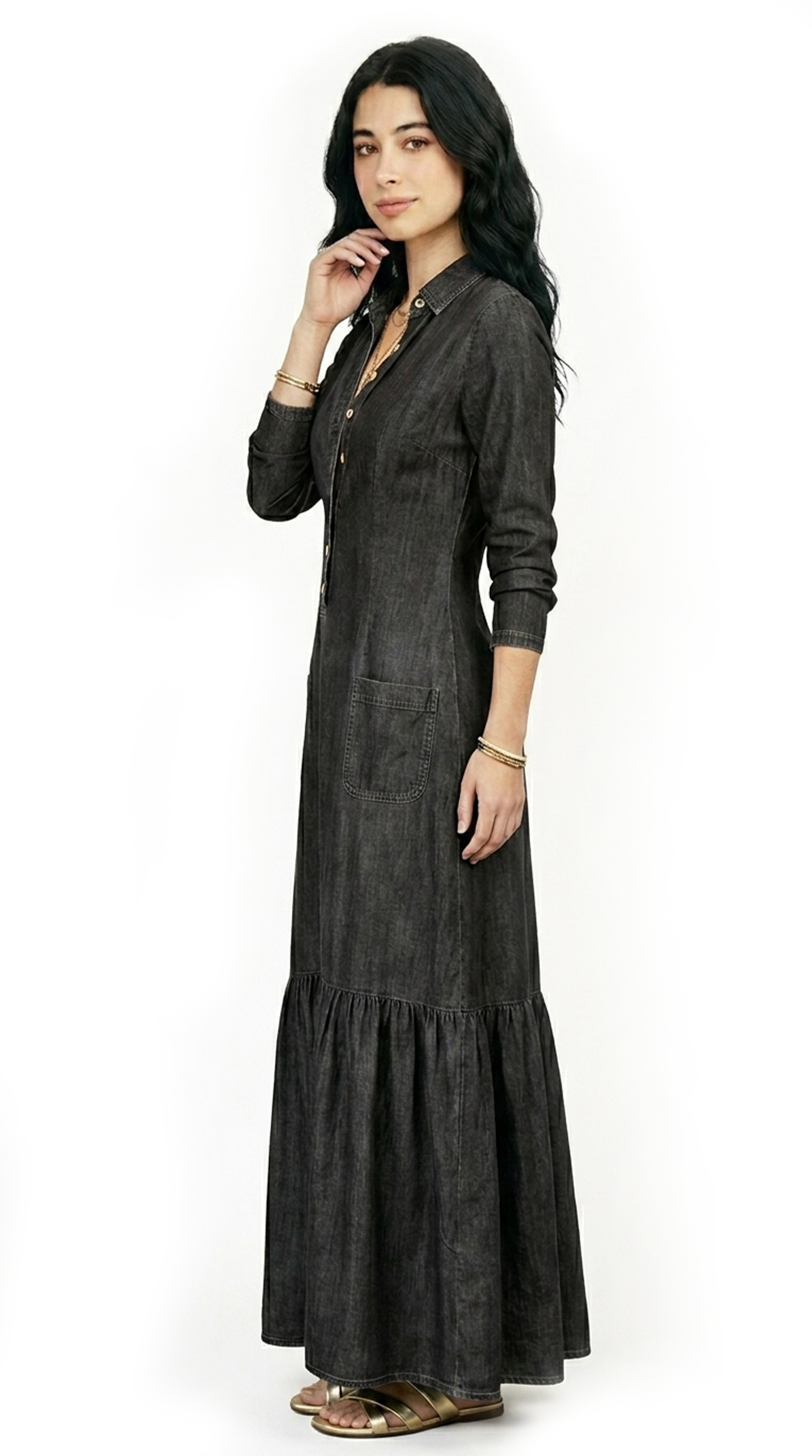 Woman wearing a blue tiered dress on a white background