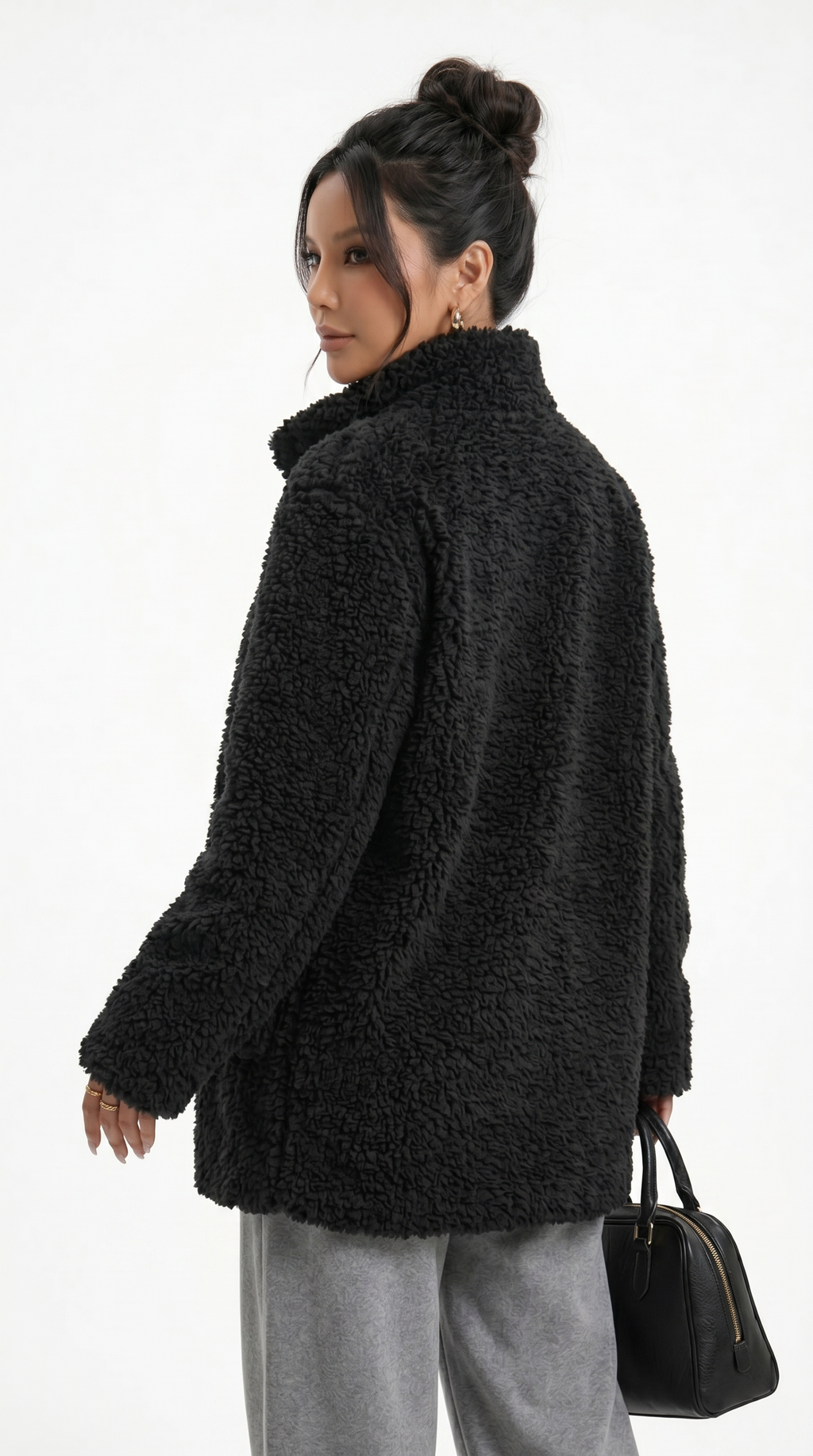 Woman wearing a black teddy coat on a white background from Meleche Fashion USA or Meléche (short as (Mé))