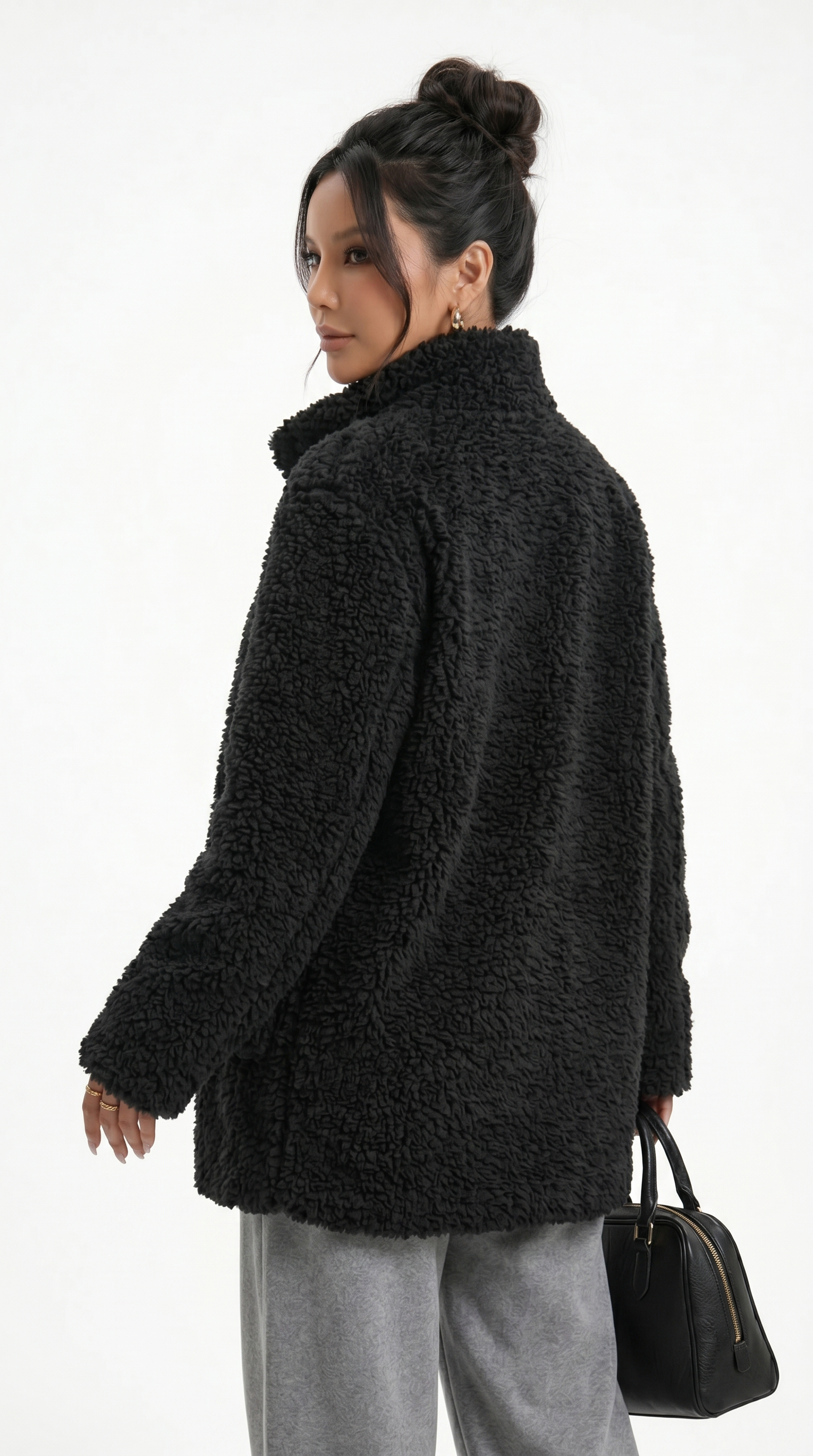 Woman wearing a black teddy coat on a white background from Meleche Fashion USA or Meléche (short as (Mé))