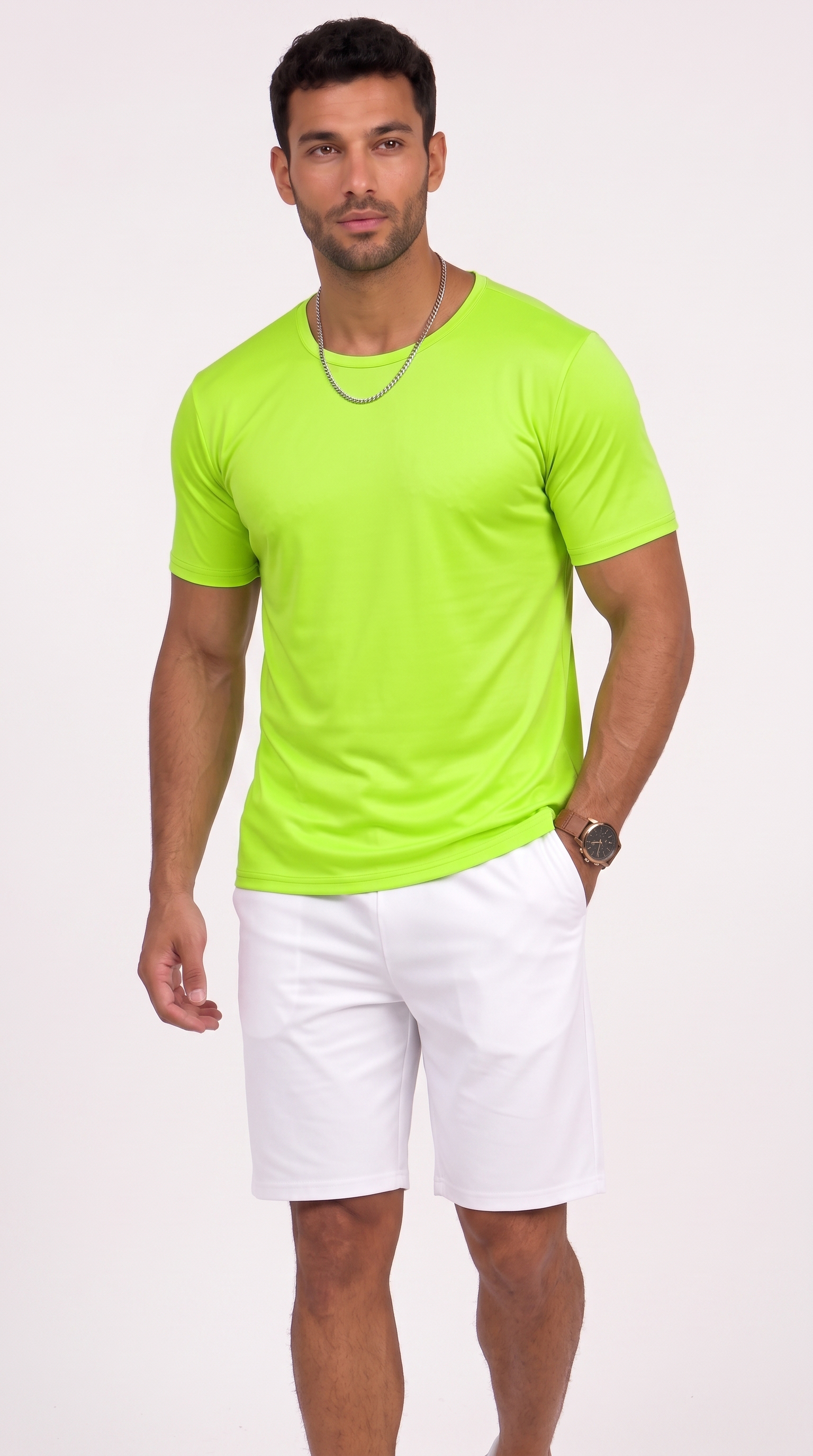 A man modeling a bright neon green short-sleeve crewneck t-shirt paired with white shorts, standing against a plain white studio background, from Meleche Fashion USA or Meléche (short as (Mé))