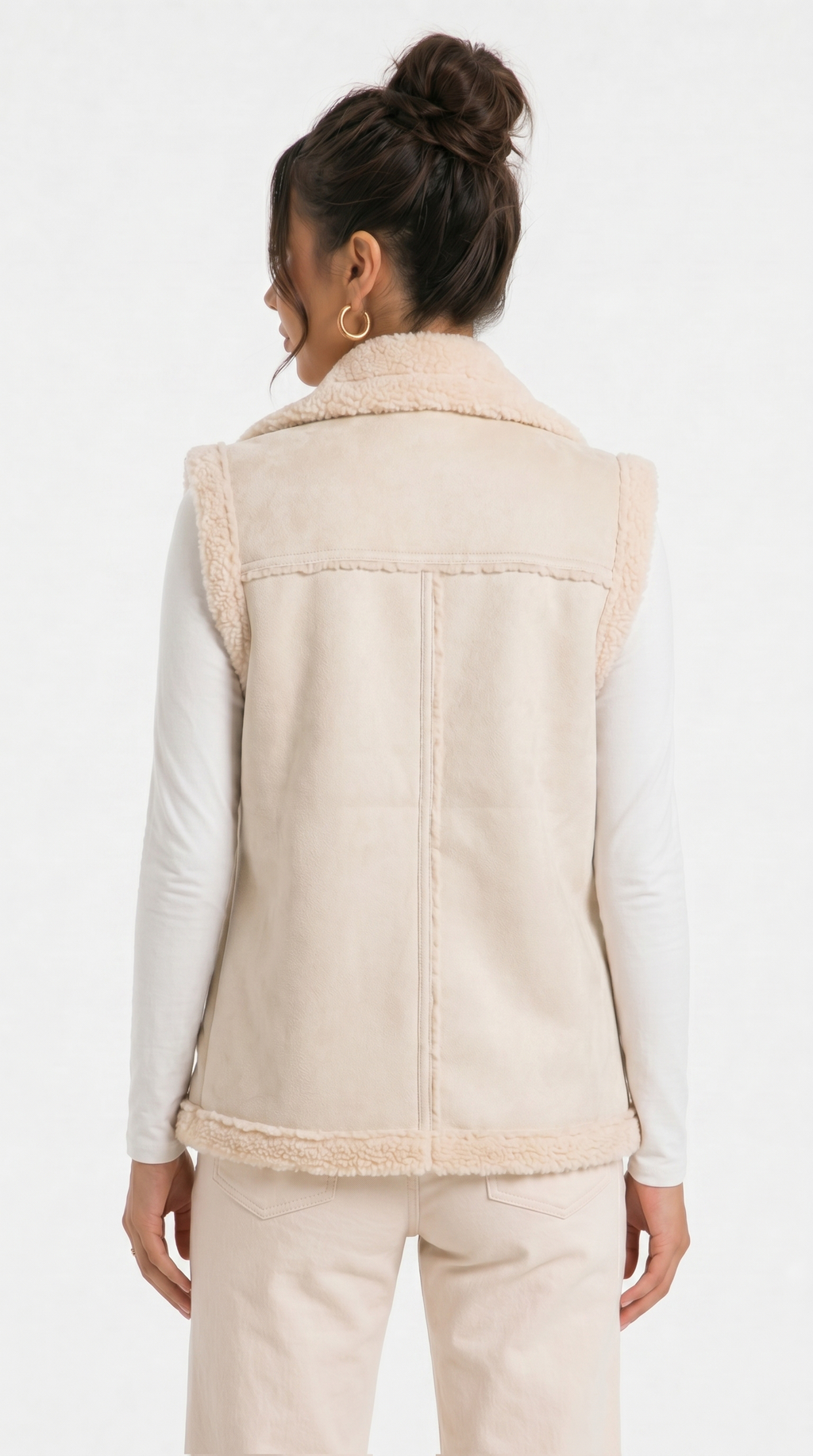 Woman wearing a beige vest with a plain background from Meleche Fashion USA or Meléche (short as (Mé))