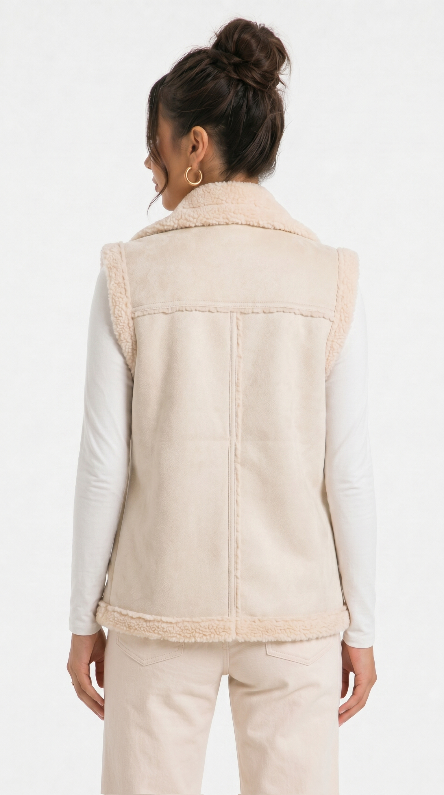 Woman wearing a beige vest with a plain background from Meleche Fashion USA or Meléche (short as (Mé))