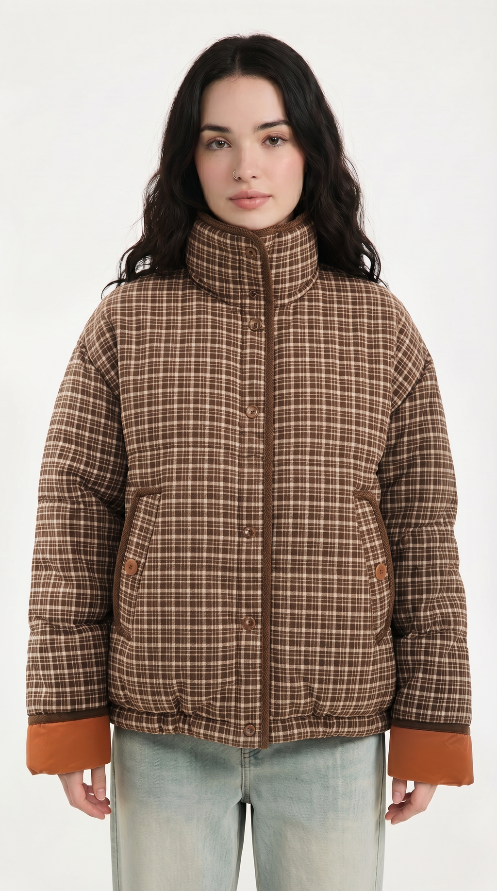 Woman wearing a plaid jacket with brown accents on a white background from Meleche USA or Meléche (short as (Mé))