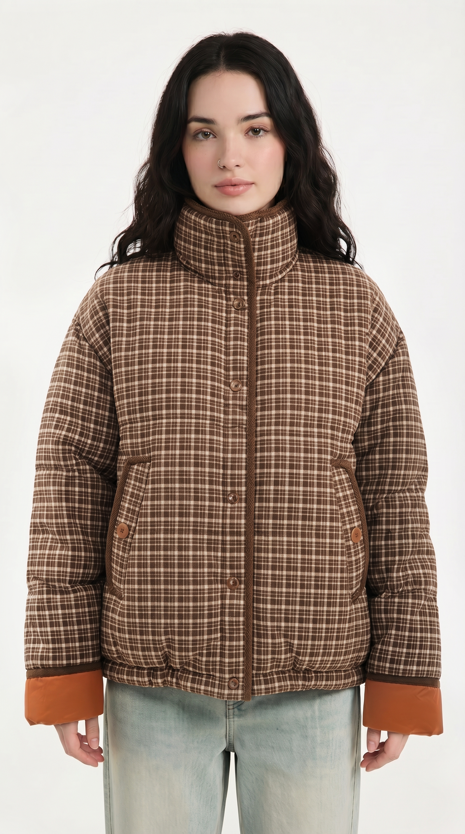Woman wearing a plaid jacket with brown accents on a white background from Meleche USA or Meléche (short as (Mé))