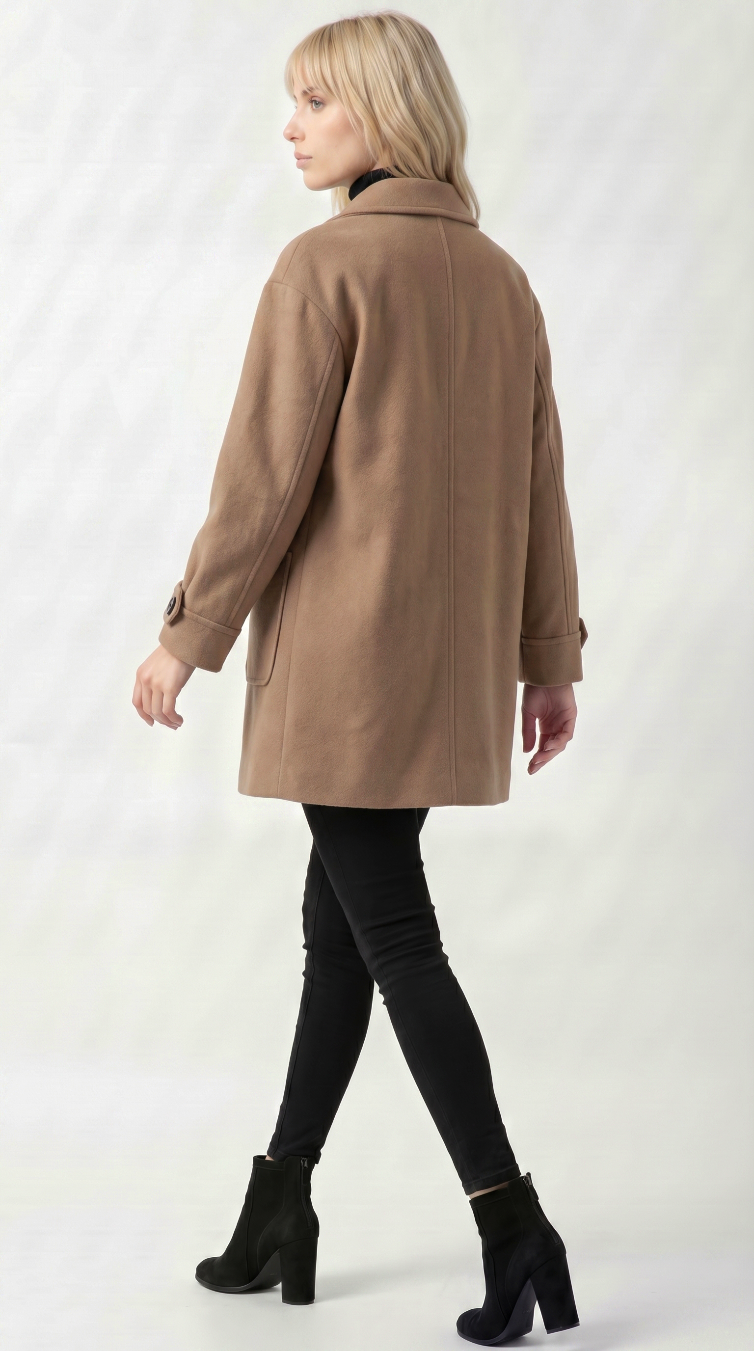 Woman wearing a brown coat on a white background from Meleche USA or Meléche (short as (Mé))