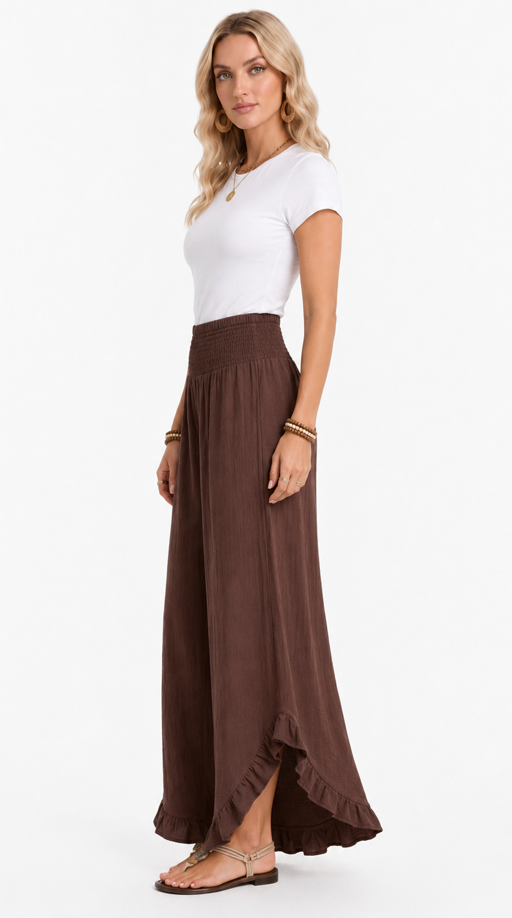 Woman wearing a white top and brown maxi skirt on a white background