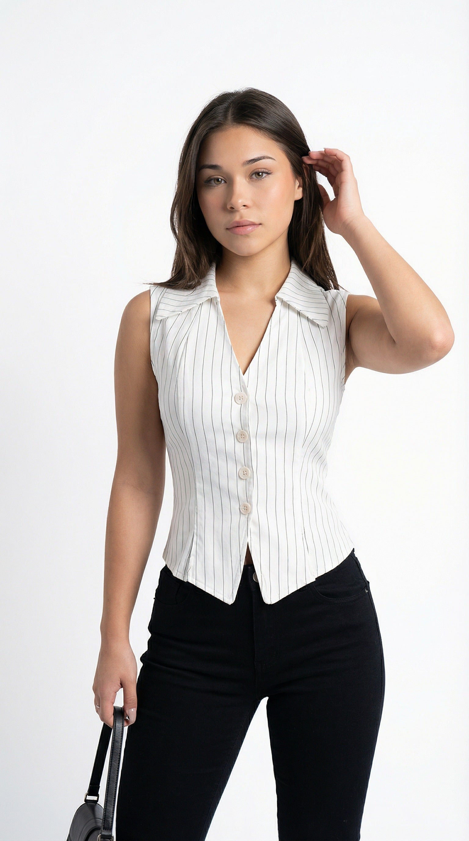 Woman wearing a white pinstripe sleeveless blouse and black pants against a plain background from Meleche or Meléche (short as (Mé))