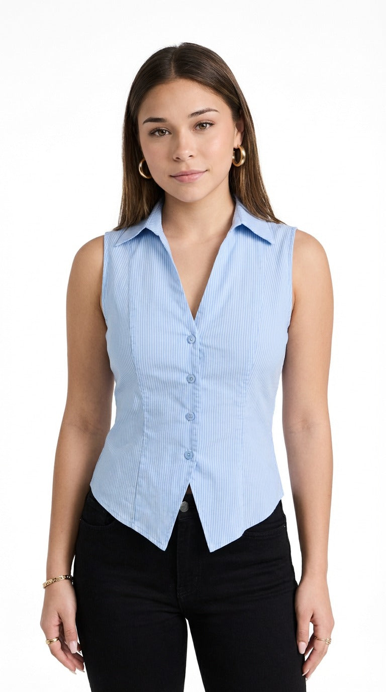 Woman wearing a light blue vest over a black top against a neutral background from Meleche or Meléche (short as (Mé))