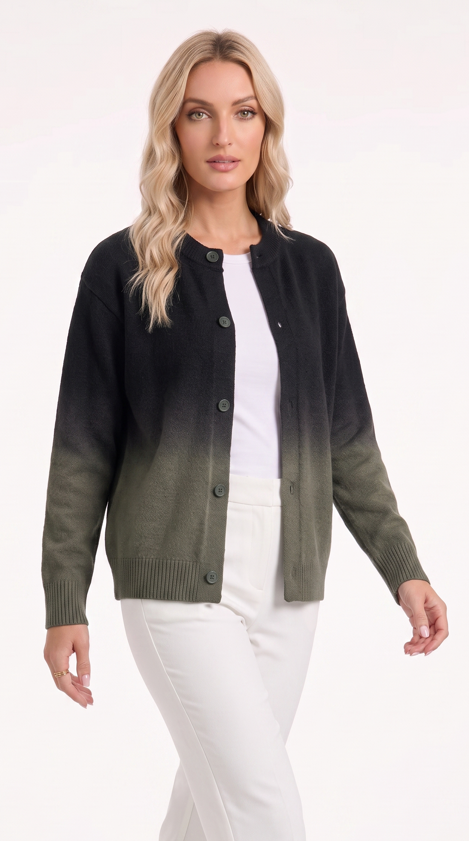 A woman modeling a dark green and black ombre cardigan sweater over a white top and white pants, photographed against a clean white studio background, from Meleche Fashion USA or Meléche (short as (Mé))