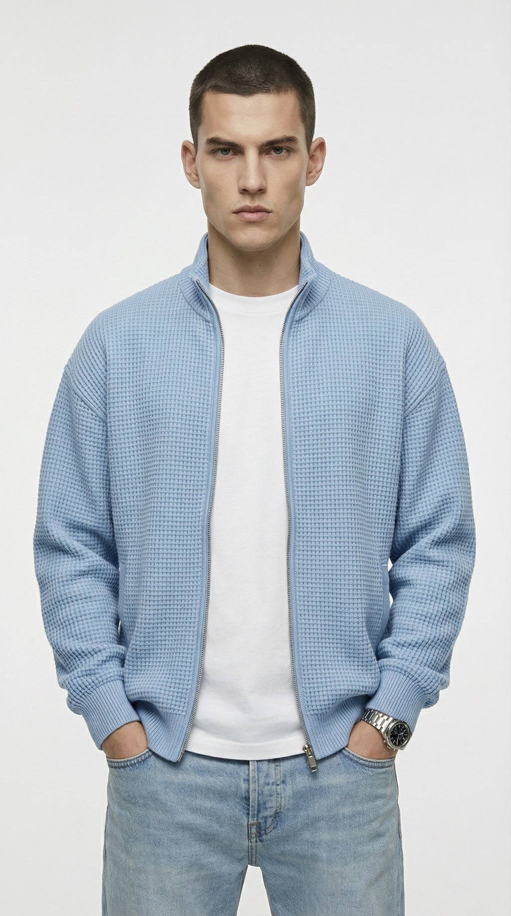 Man wearing a light blue textured jacket from Meleche or Meléche (short as (Mé))