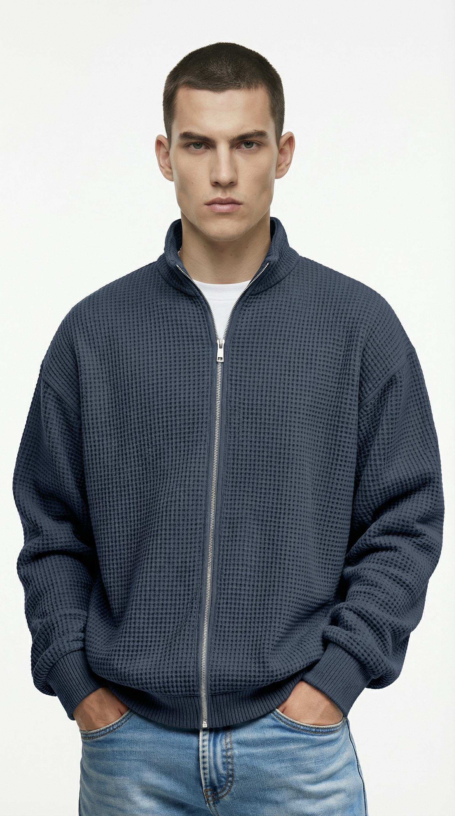 Man wearing a blue zip-up sweatshirt from Meleche or Meléche (short as (Mé))