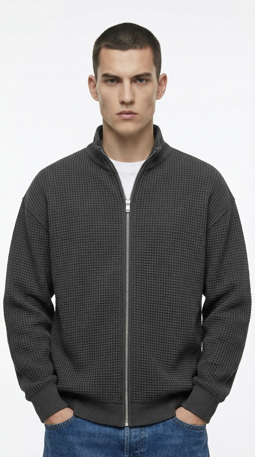 Man wearing a dark gray checkered jacket from Meleche or Meléche (short as (Mé))