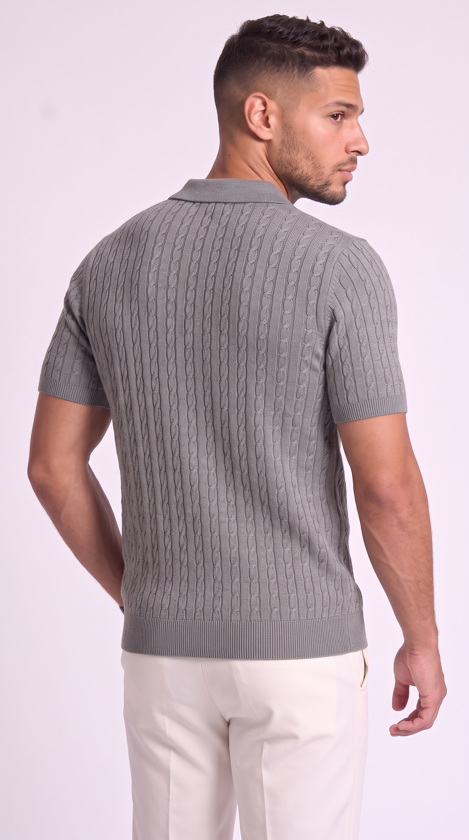 A man wearing a gray short-sleeve knit polo shirt with a cable pattern, shown from the back against a light studio background, from Meleche Fashion USA or Meléche (short as (Mé))