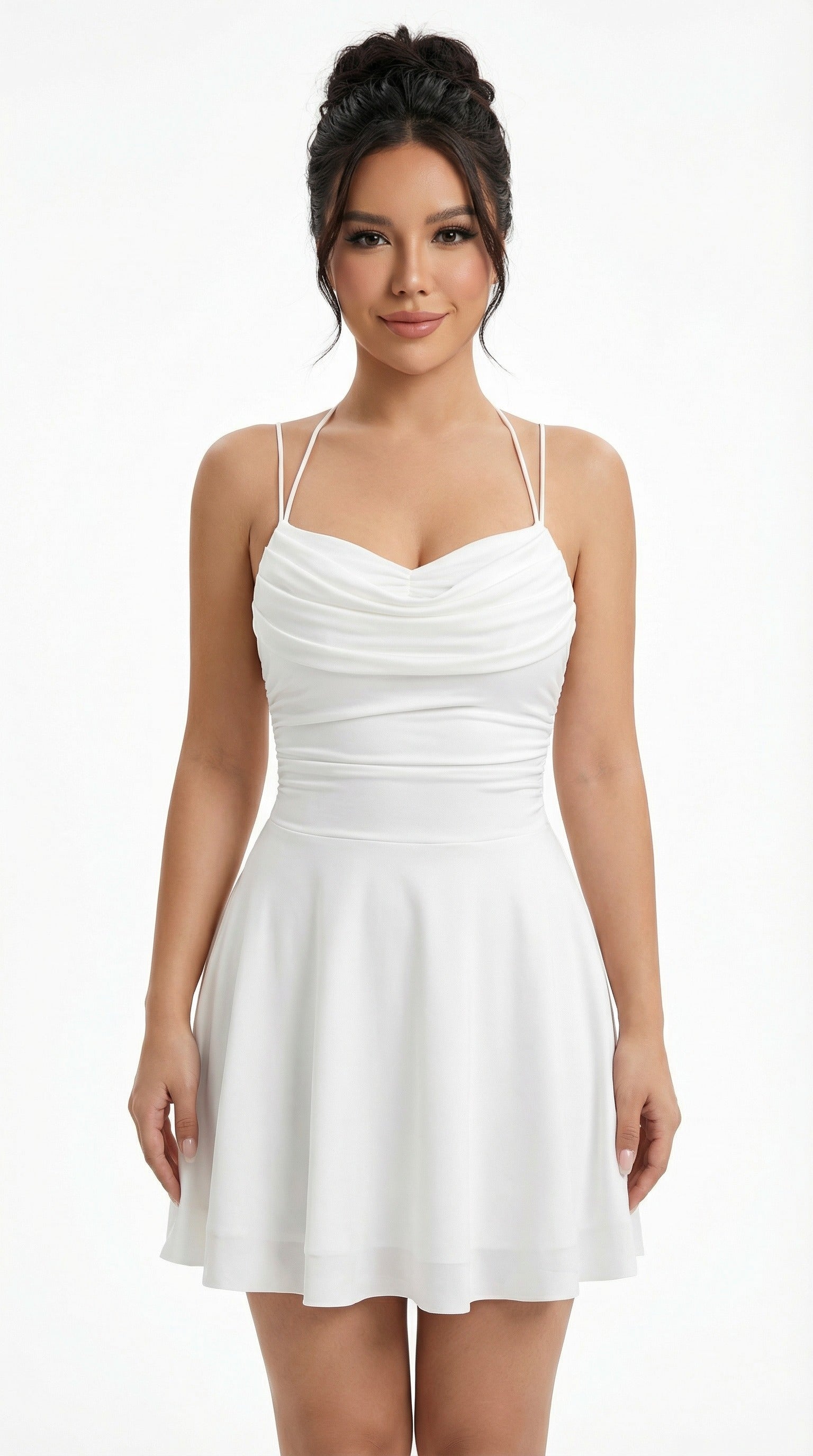 Woman in a white dress holding a black handbag against a neutral background