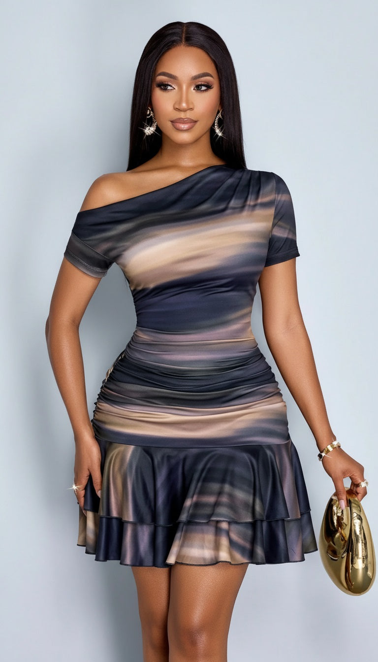 Woman wearing a one-shoulder dress with a gradient pattern from Meleche or Meléche (short as (Mé))