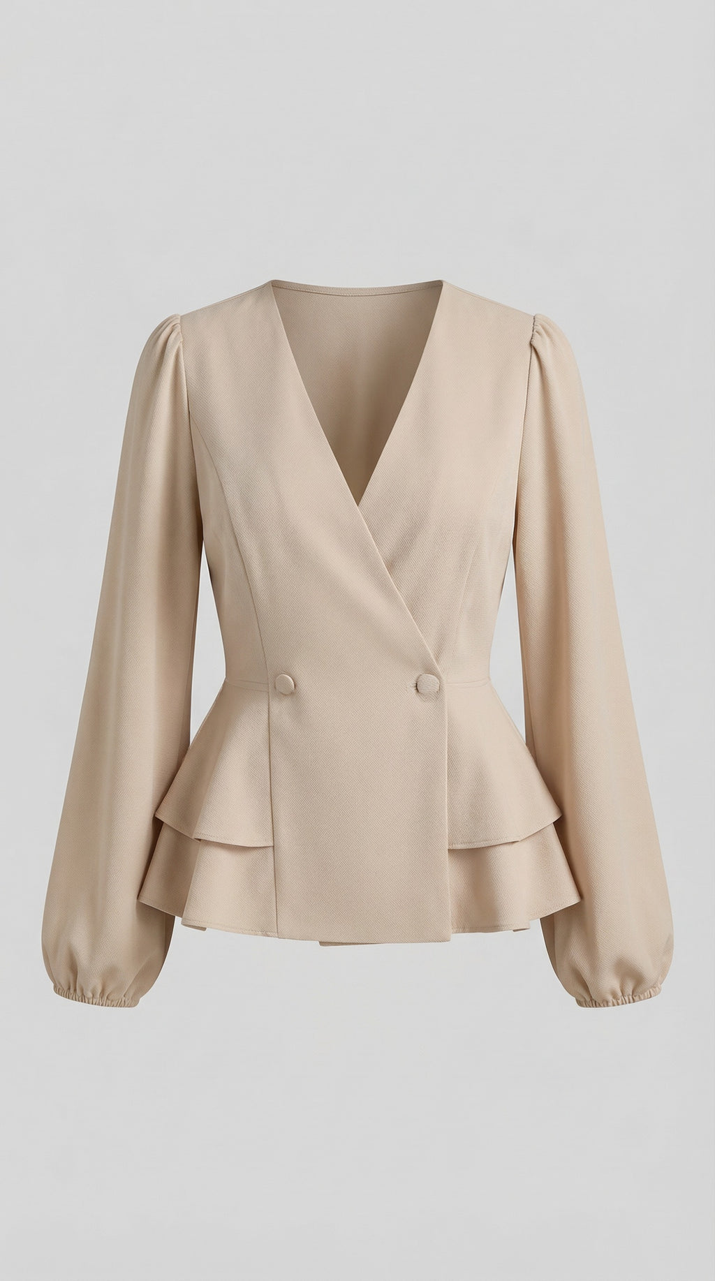 Woman wearing a beige peplum top and blue jeans, standing against a neutral background from Meleche or Meléche (short as (Mé))