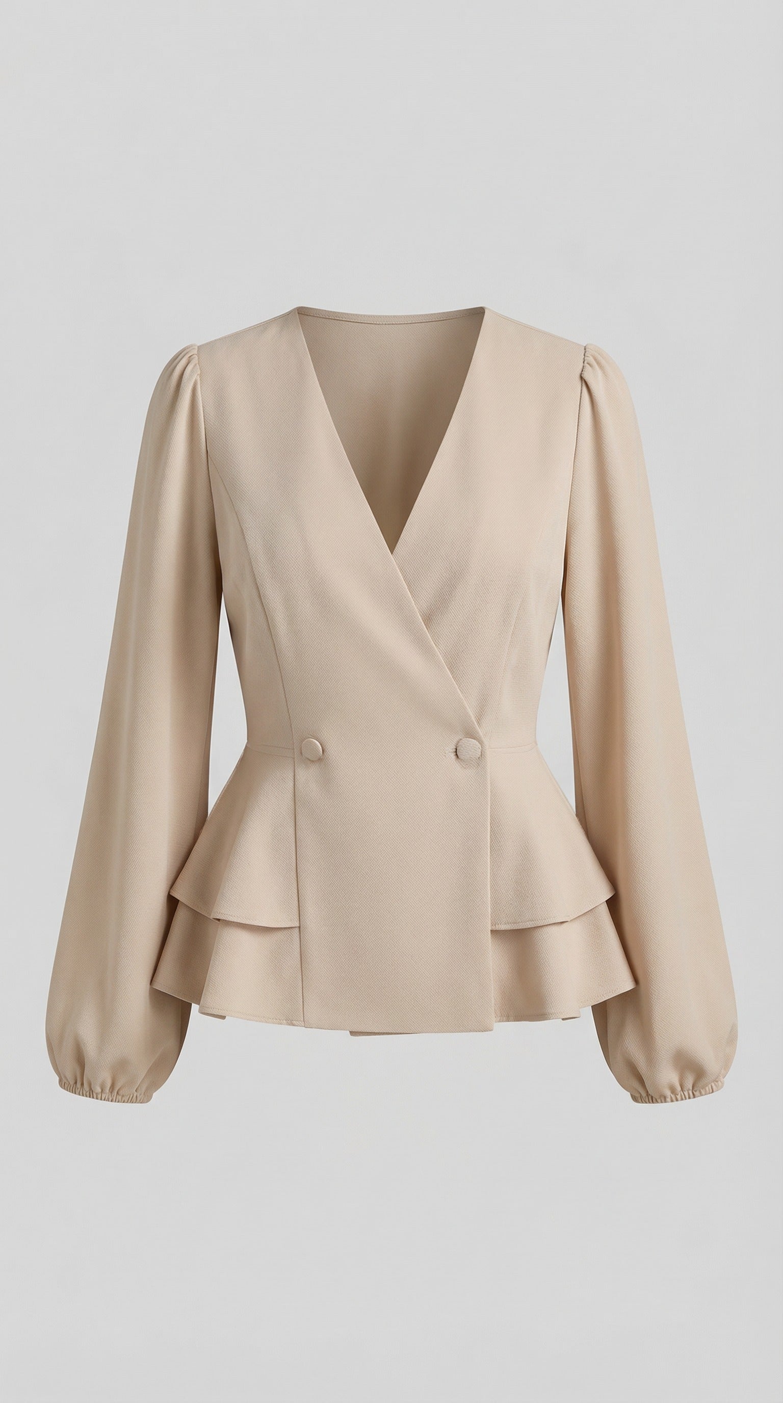 Woman wearing a beige peplum top and blue jeans, standing against a neutral background from Meleche or Meléche (short as (Mé))