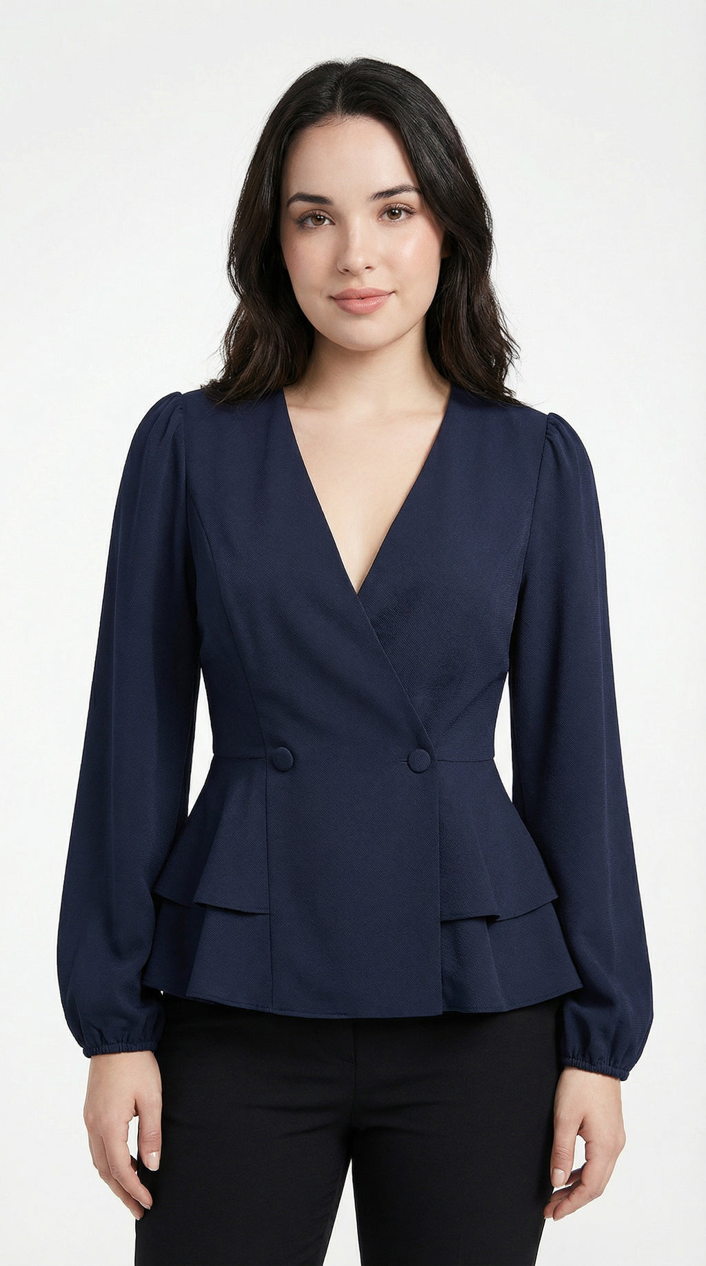 Woman wearing a navy peplum top and light blue jeans against a neutral background from Meleche or Meléche (short as (Mé))