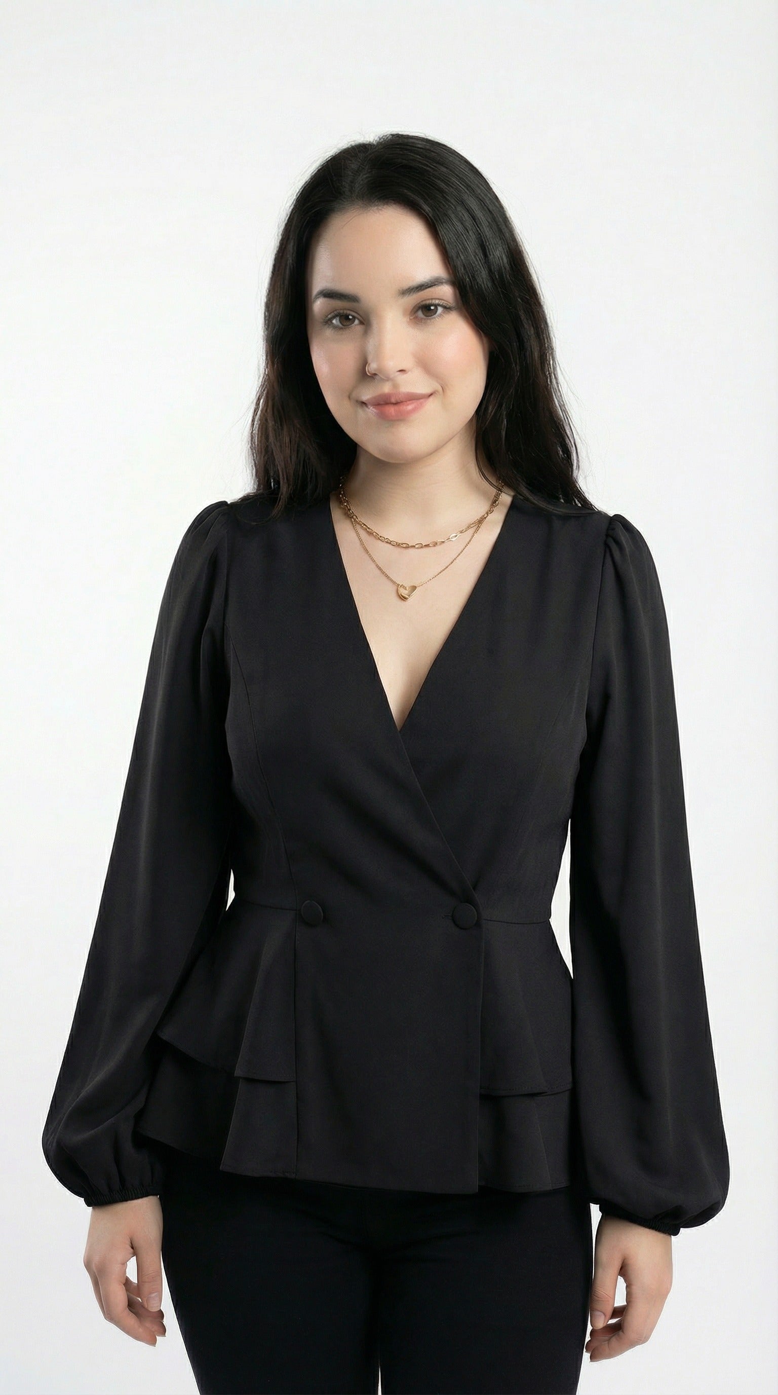 Woman wearing a black peplum top and blue jeans against a neutral background from Meleche or Meléche (short as (Mé))