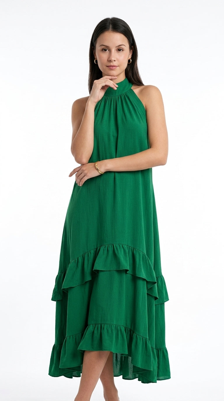 A woman modeling a sleeveless green halter midi dress with a tiered ruffle hem against a plain white studio background, from Meleche Fashion USA or Meléche (short as (Mé))